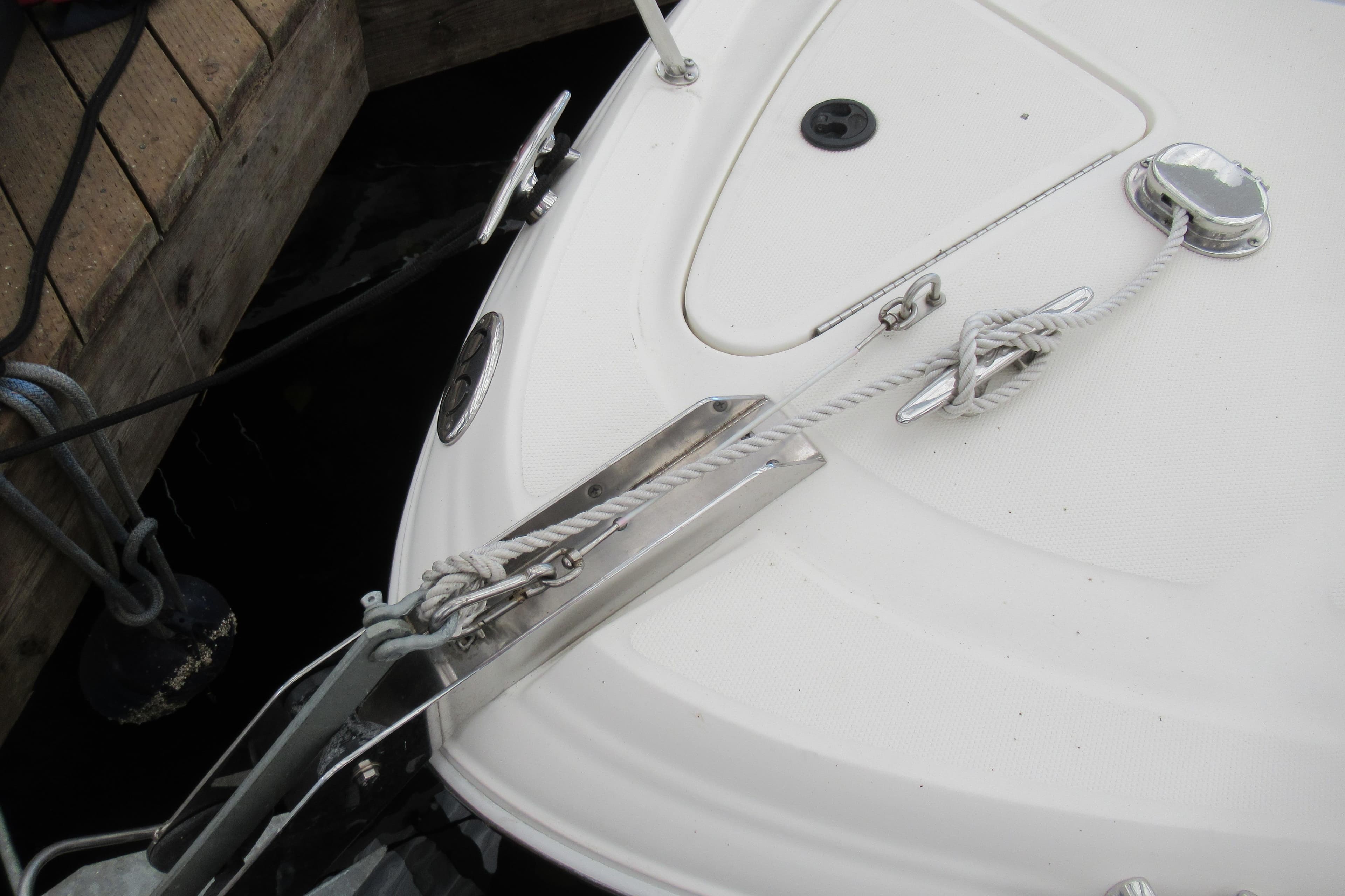 2001 Searay 280 Sundancer boat docked with secured ropes.