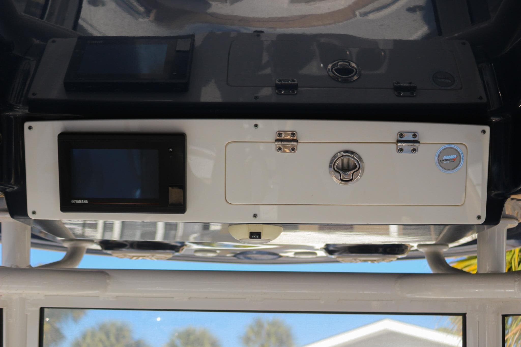 2020 Sportsman Masters 267OE Bay Boat console with Yamaha display and storage compartment.
