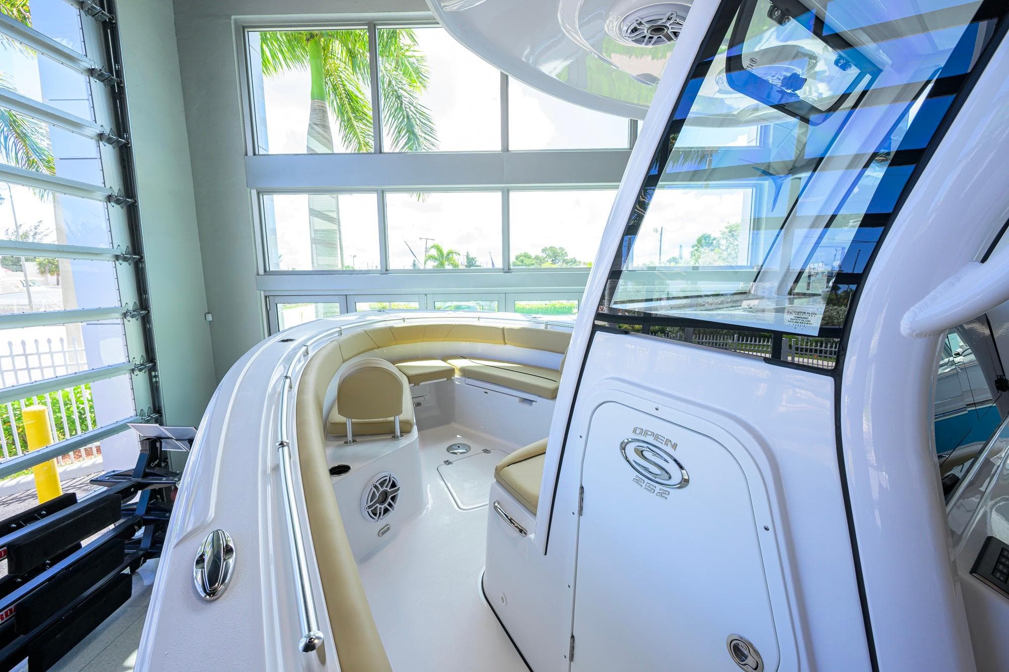 2026 Sportsman Open 252 Center Console boat interior with seating and windows.