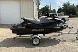 2017 Sea-Doo GTX 155 jet ski on trailer, parked outdoors.