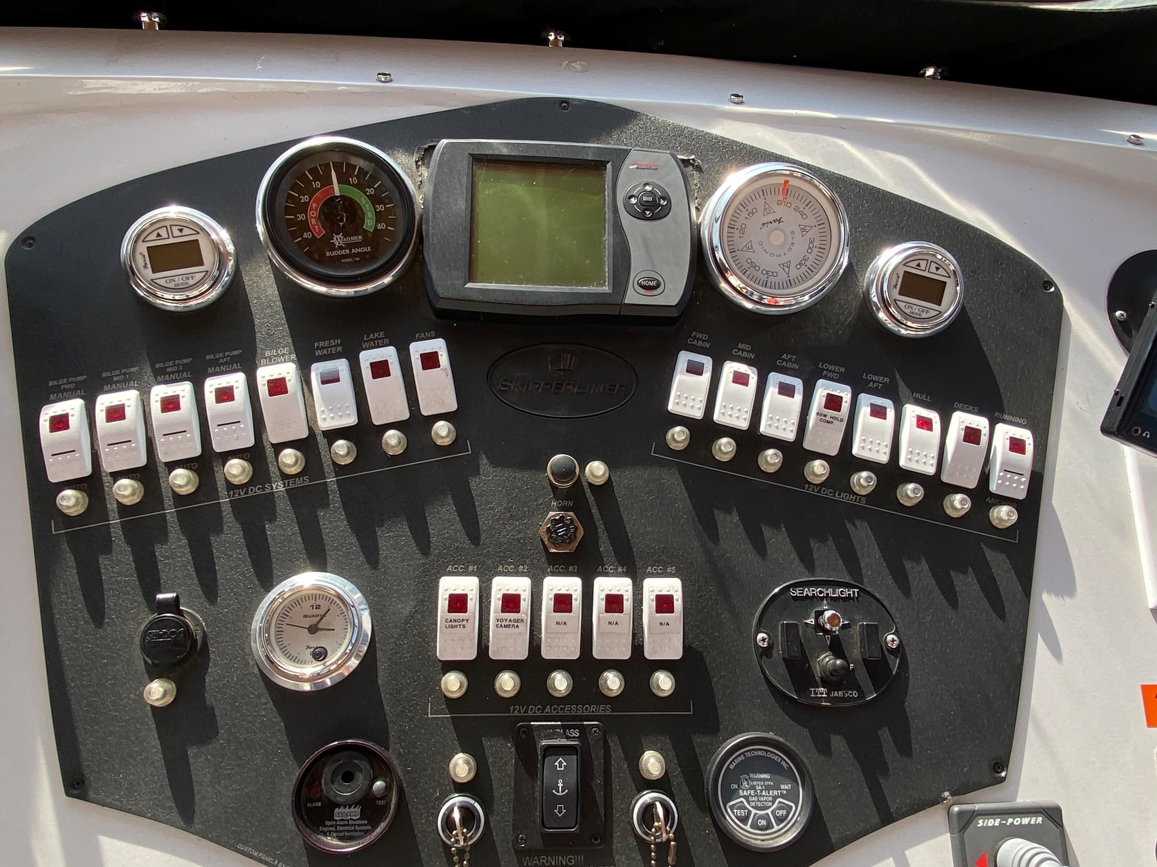 Control panel of a 2005 Skipperliner Millenium boat with gauges and switches.