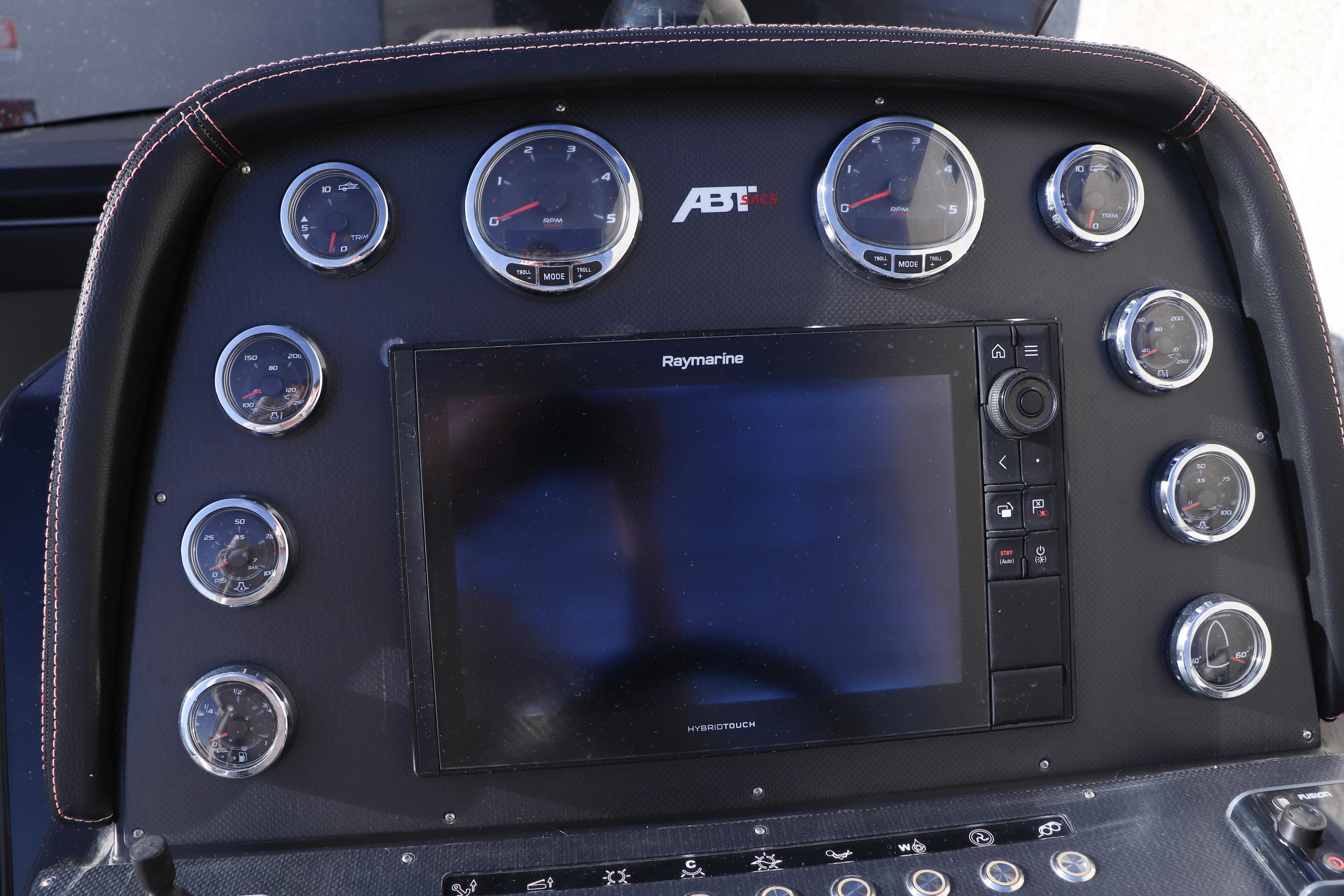 Control panel of 2021 SACS Strider 11 OB Opendeck with gauges and Raymarine display.