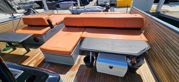 2019 Sunreef 40 Open yacht with orange seating and wooden deck.