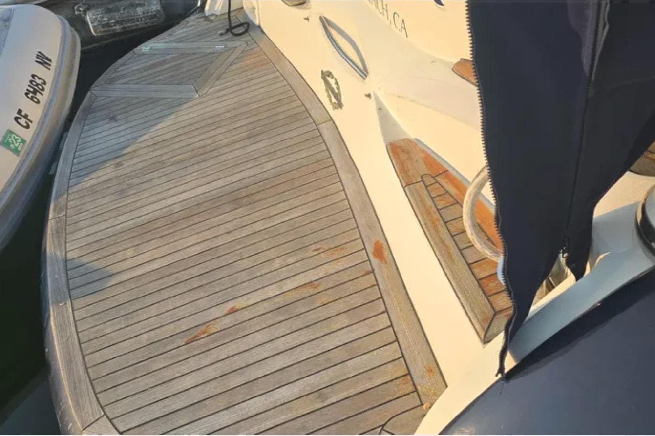 2001 Sunseeker Camargue 44 yacht deck with wooden finish and mooring details.