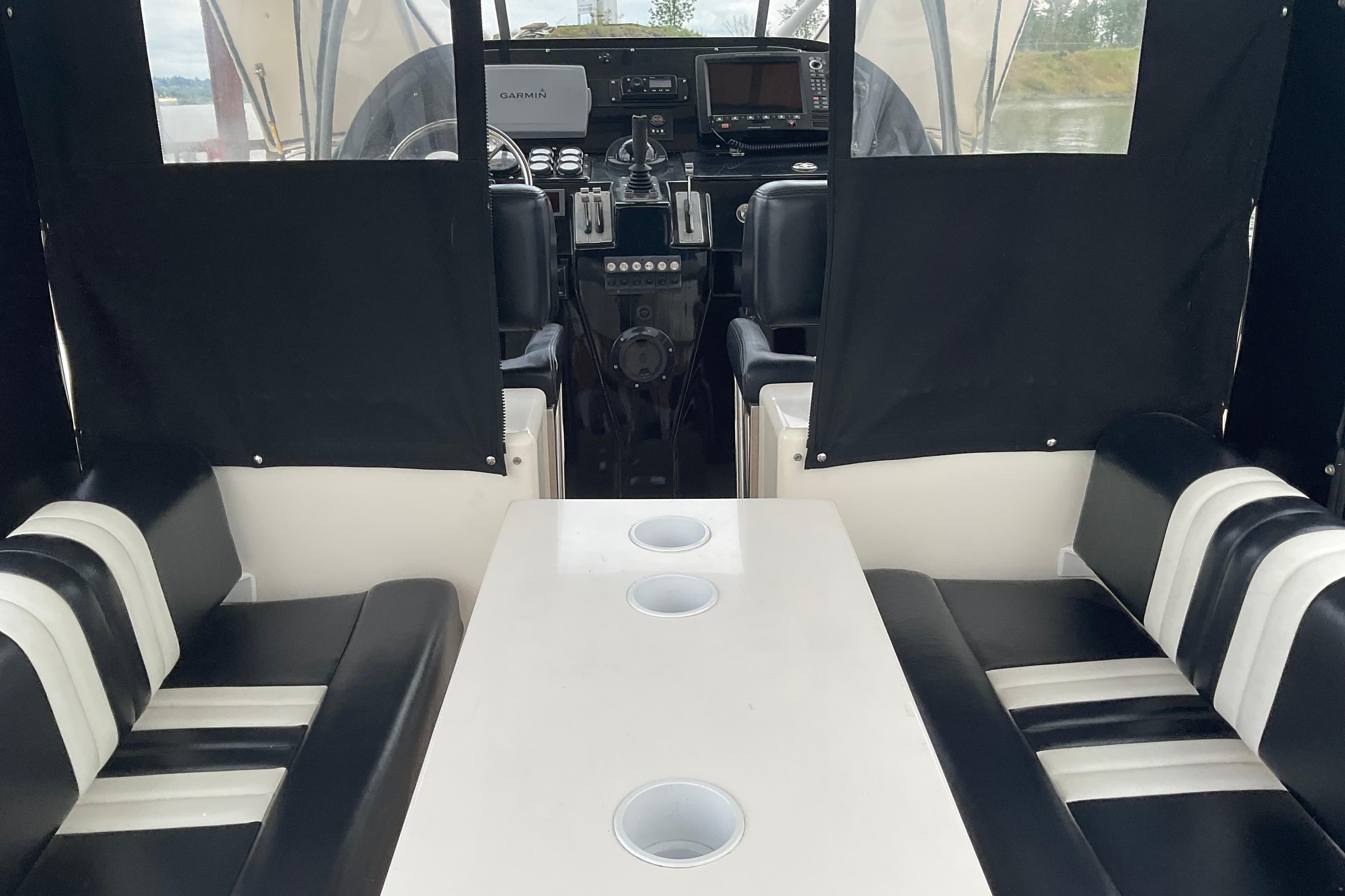 Interior of 2004 Rivolta PT Runner 4.0 boat with seating and navigation equipment.