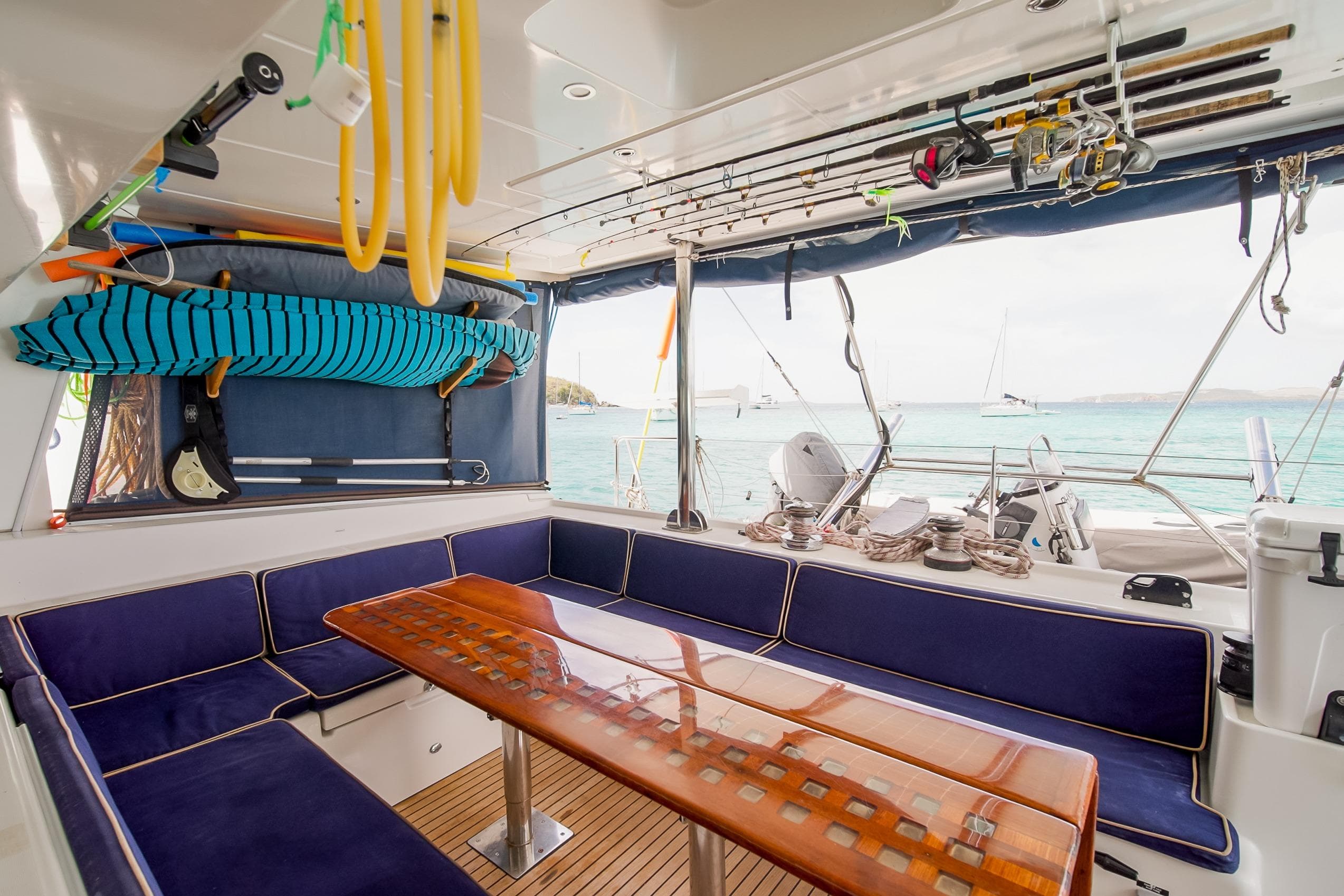 Spacious 2007 Lagoon 500 yacht interior with seating, table, and ocean view.