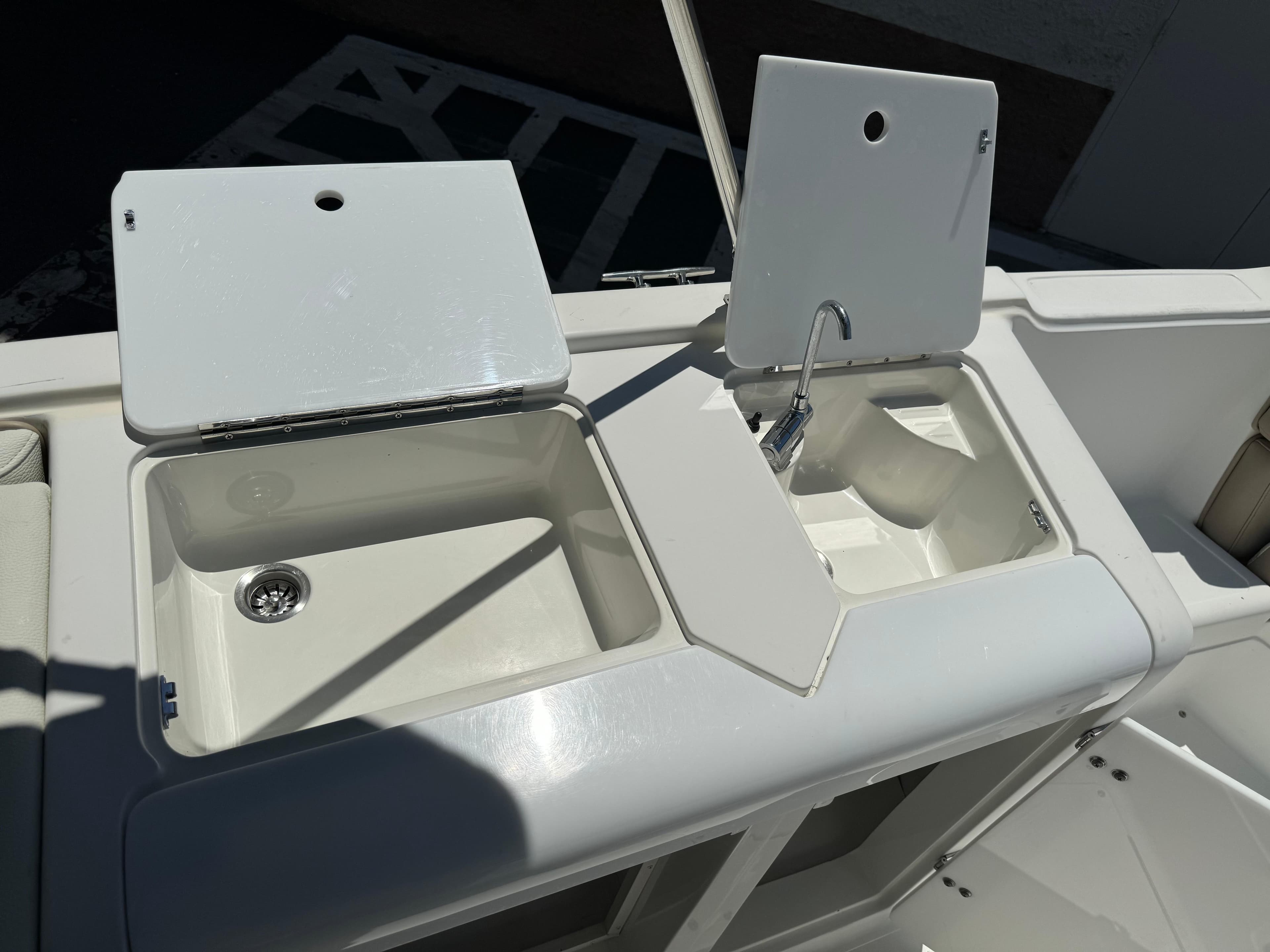 2001 Cobalt 25 LS boat sink and storage compartments.