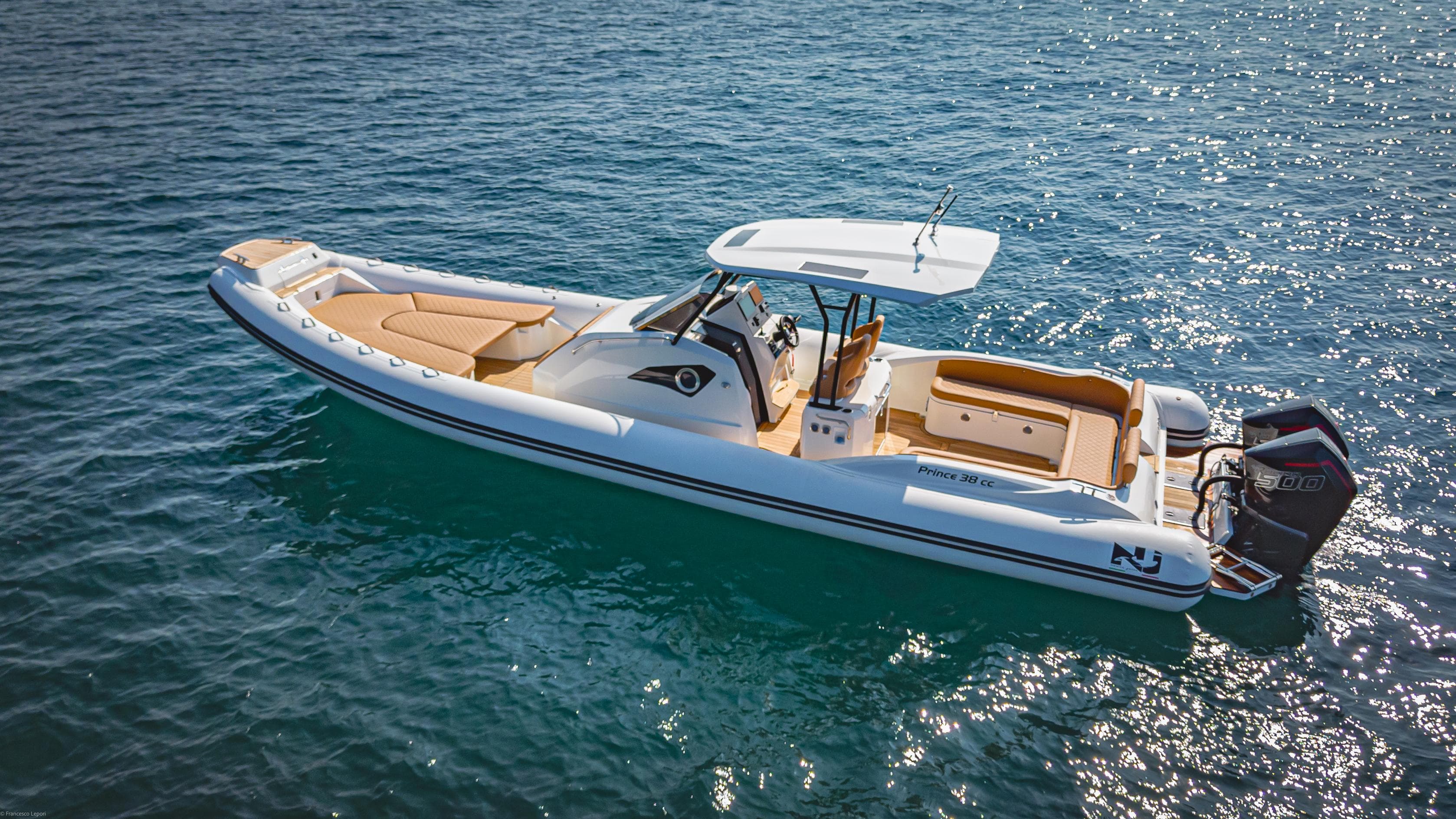 2024 Nuova Jolly Prince 38 boat on clear blue water.