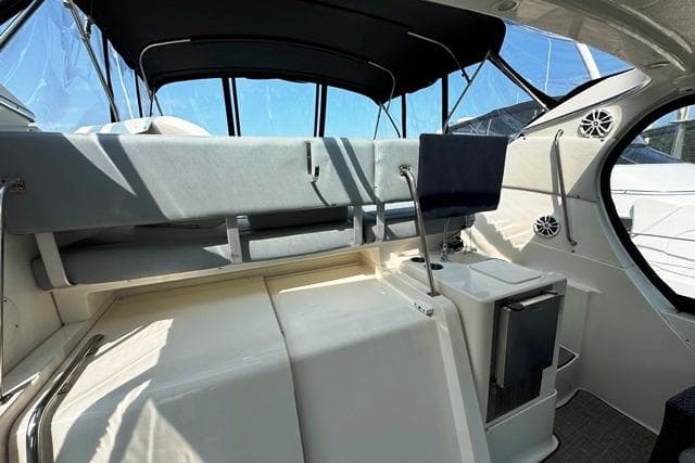 2004 Silverton 35 MY Aft Cabin Motoryacht interior with seating and helm station.