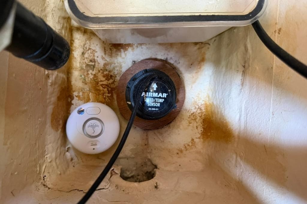 Airmar speed/temp sensor in Hunter 410 boat, 2002 model, with visible wiring.