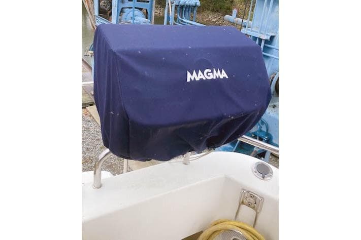 Covered grill on 2016 Ranger Tugs R-31 boat deck, featuring Magma cover.