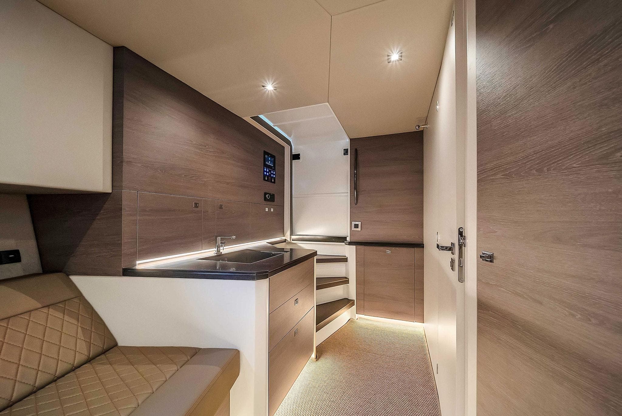 Interior of 2021 Vanquish Yachts VQ 45, featuring modern kitchen and seating area.