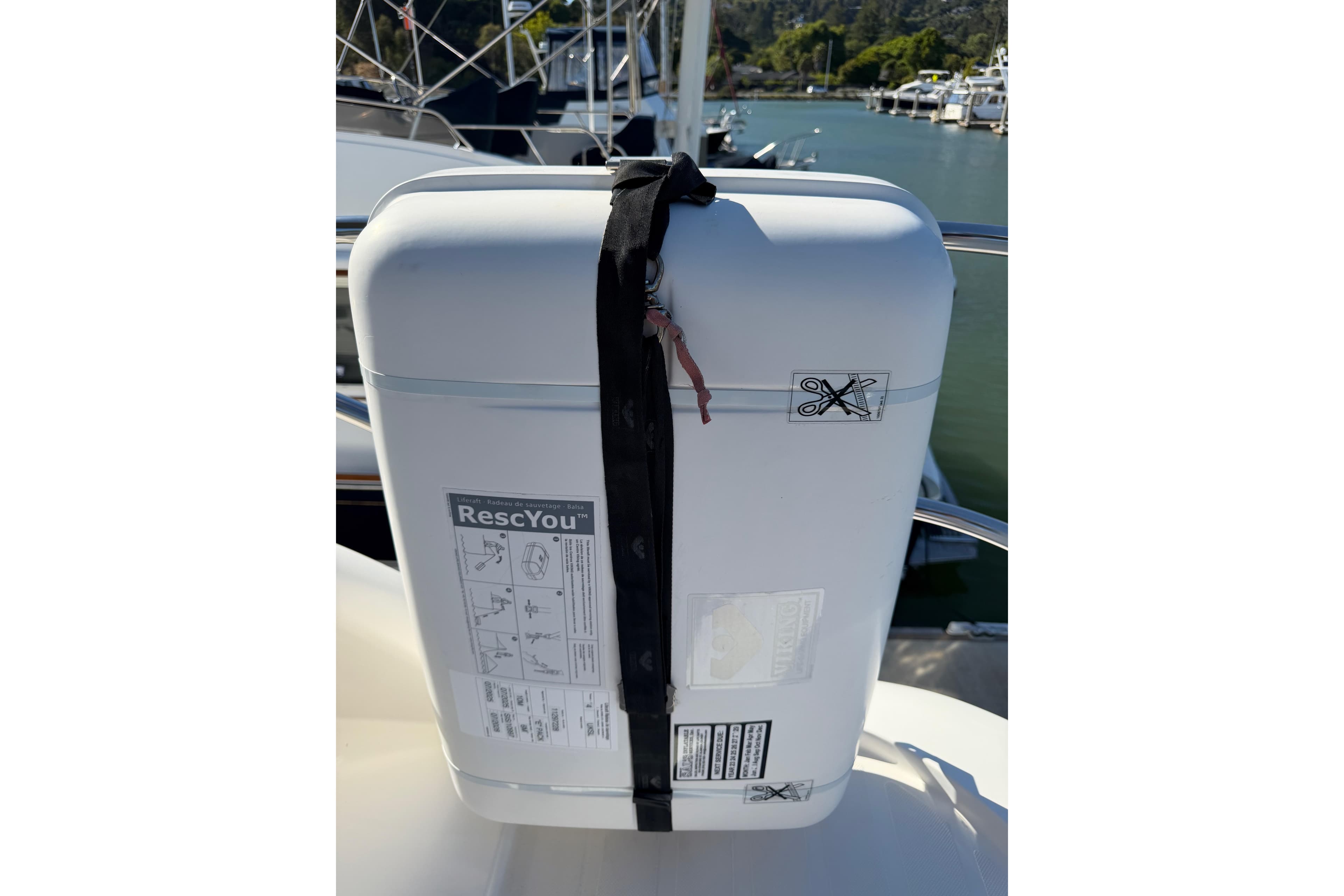 White RescYou safety container on Aspen C120 boat, 2017 model, docked by the marina.