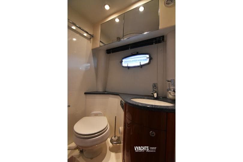 Luxurious bathroom in 2005 Fairline Targa 47 GT yacht, featuring modern fixtures and elegant design.