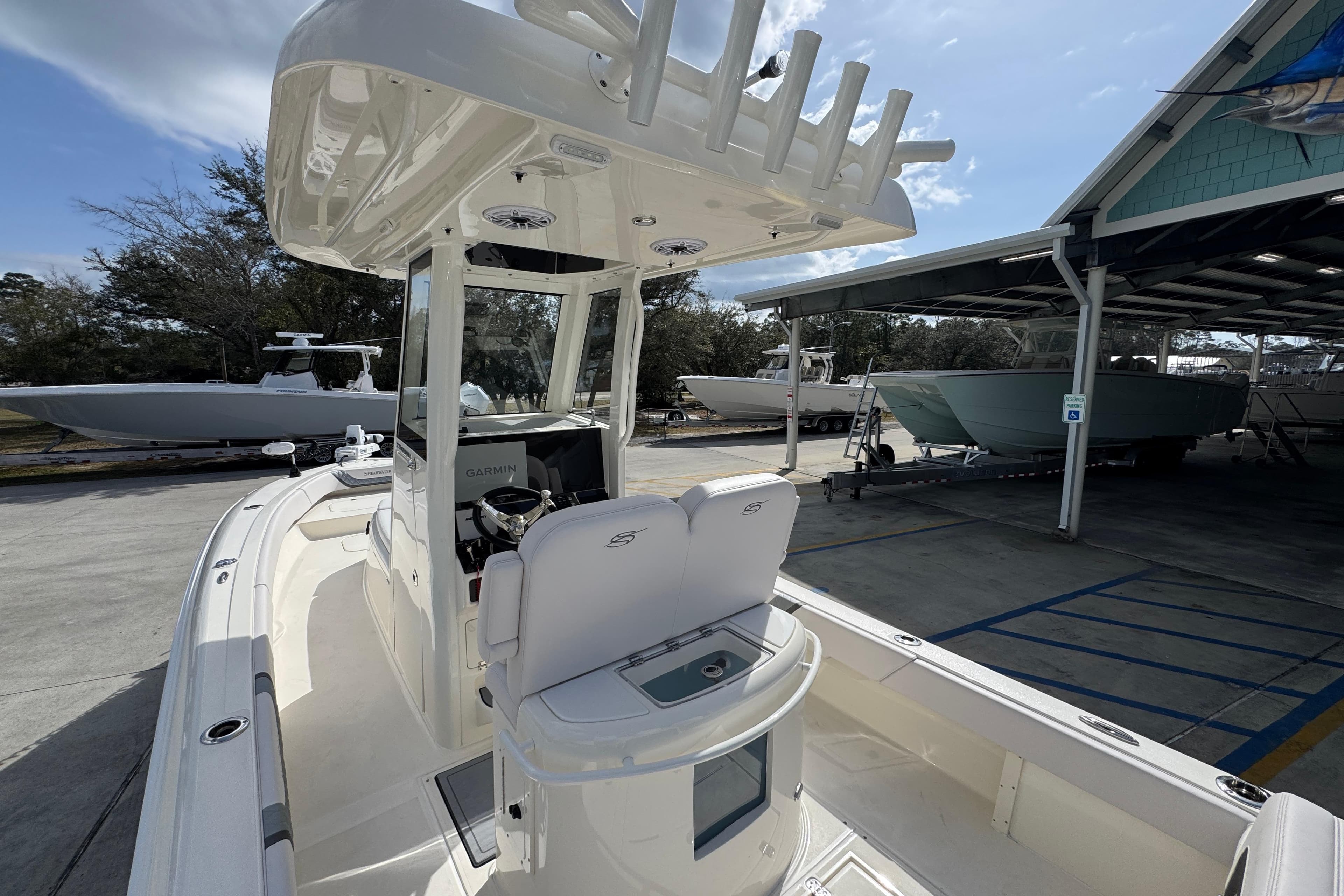 2026 ShearWater 270 SS Open Carolina boat docked, featuring modern helm and seating.