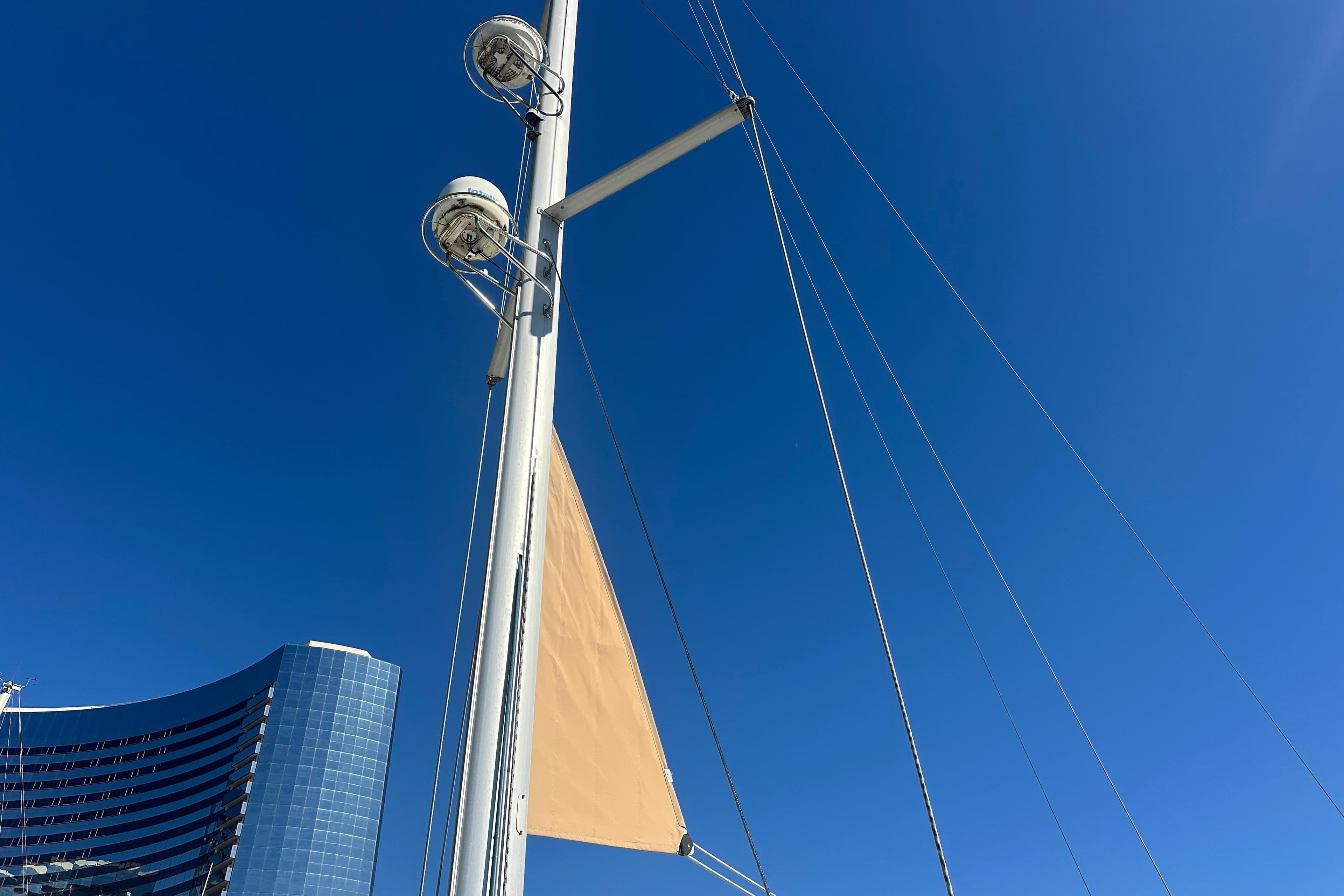 Mast of 2008 Jeanneau Sun Odyssey 45 DS sailboat against clear blue sky.