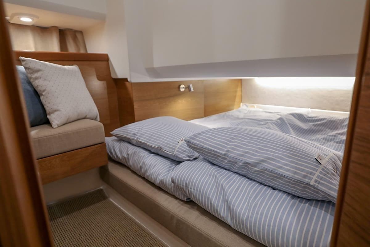 Interior of Nimbus Tender 11 yacht, cozy bedroom, model year 2025.
