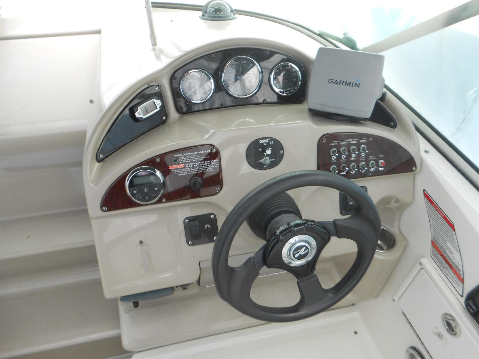 2008 Sea Ray 260 Sundancer helm with Garmin navigation system and instrument panel.