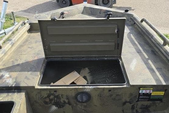 Open storage compartment on 2026 Havoc 1860 DBST boat, showcasing interior space.