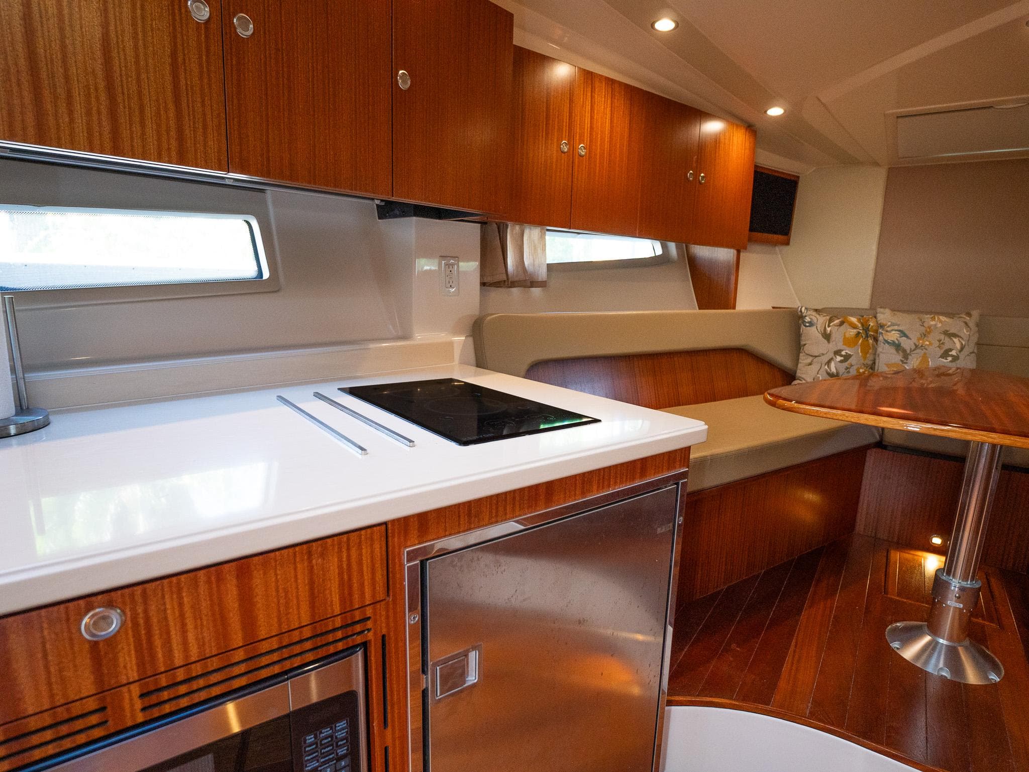 Luxurious interior of 2014 Pursuit SC 365i Sport Coupe with modern kitchen and seating area.