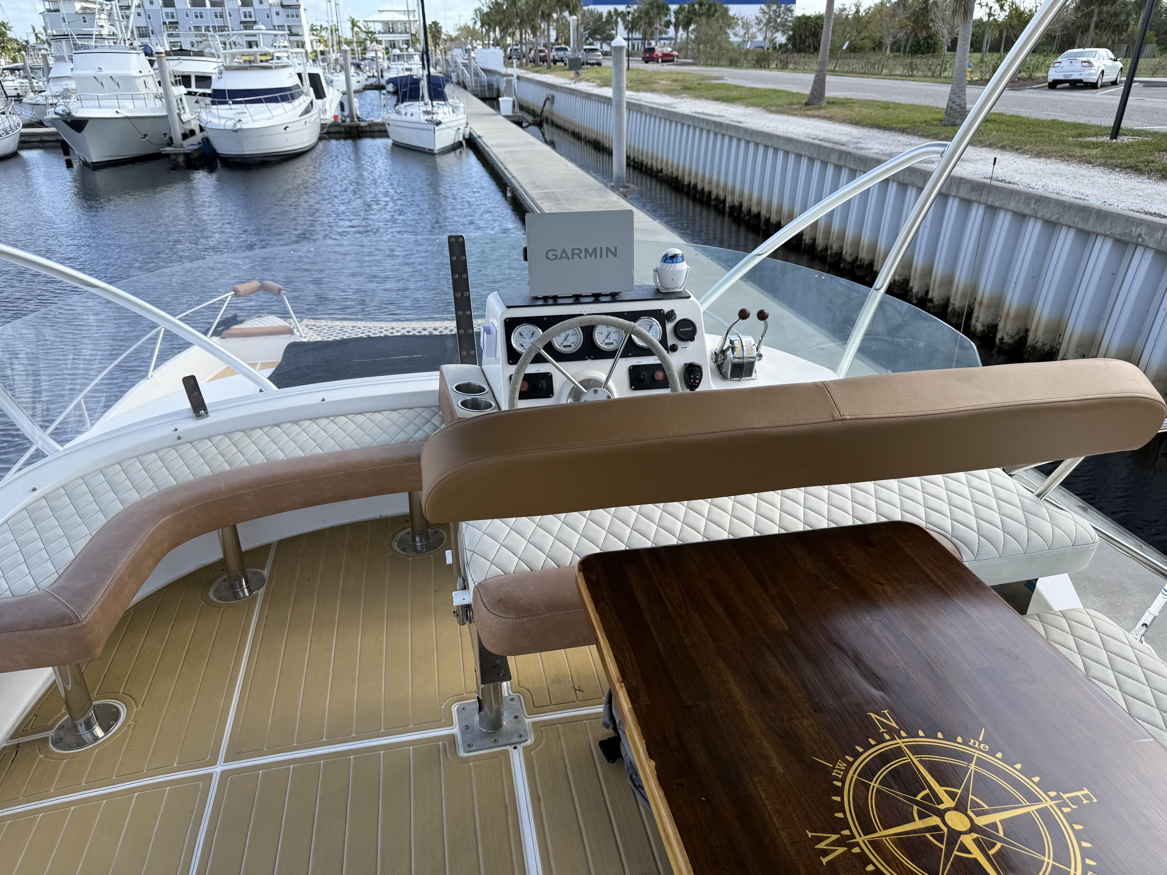 Flybridge of 1999 Fountaine Pajot Maryland 37 yacht with seating and navigation equipment.
