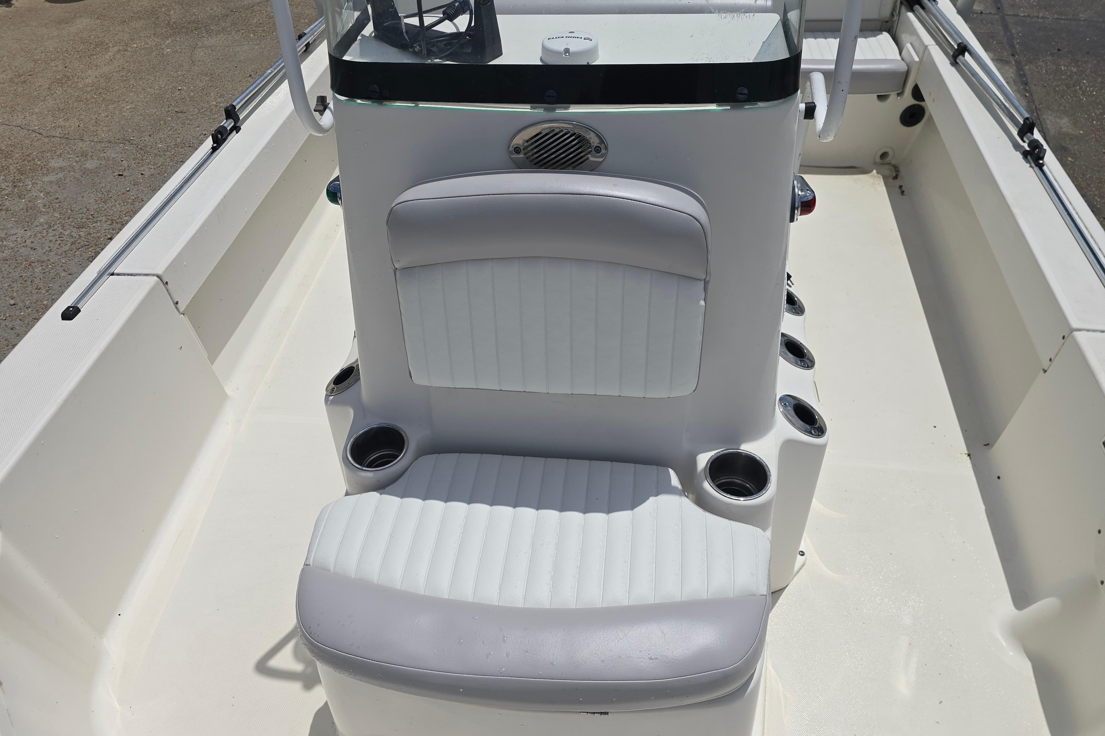 2015 Sea Born FX22 Bay boat interior with white seating and cup holders.