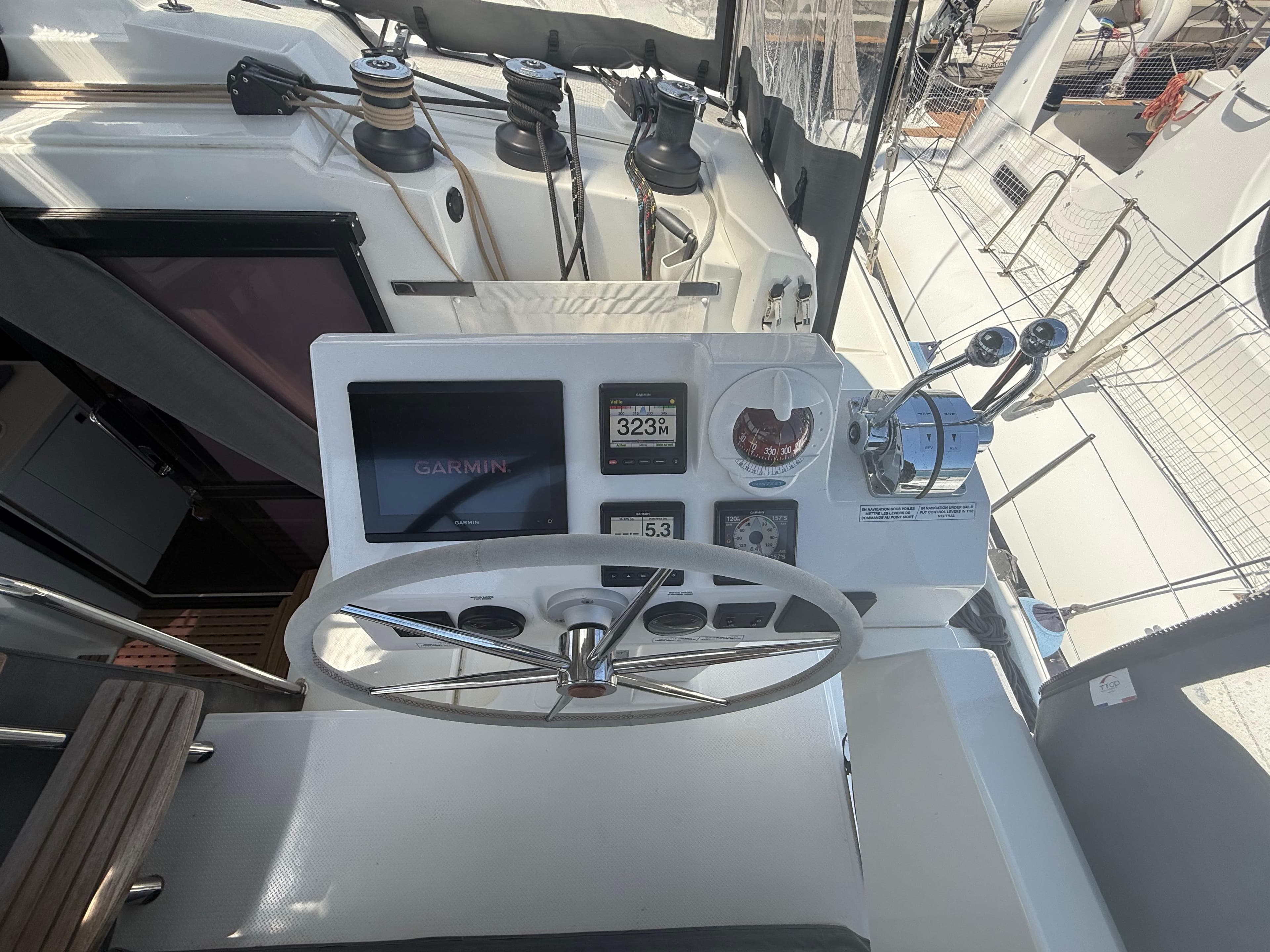 Cockpit of 2022 Fountaine Pajot Astrea 42 catamaran with Garmin navigation system.