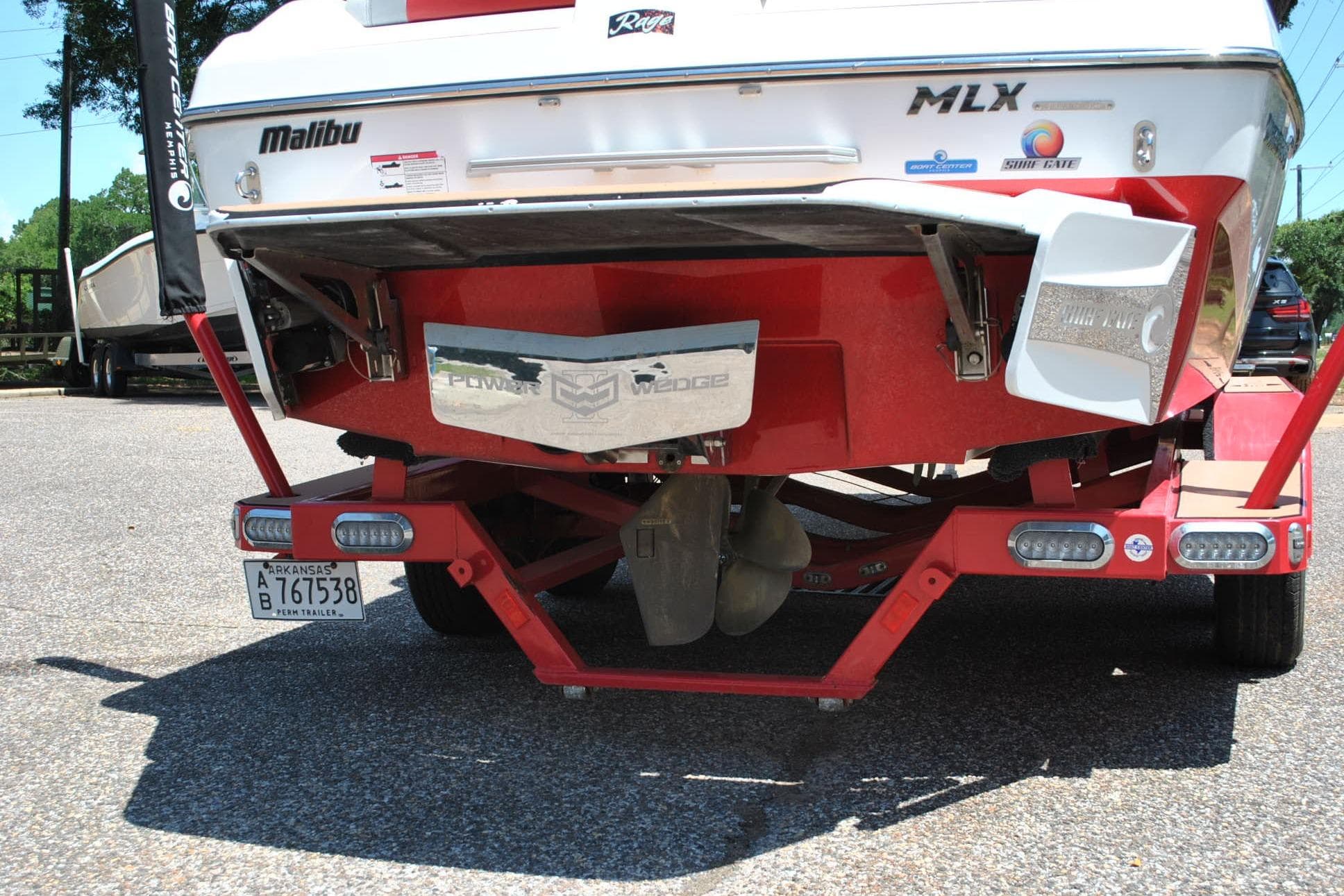 2018 Malibu Wakesetter 21 MLX boat rear view on trailer, Arkansas license plate visible.