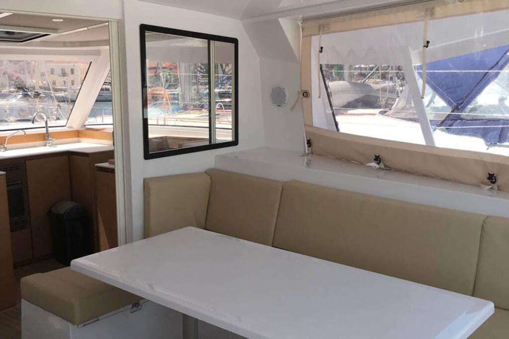 Interior of 2016 Nautitech 40 Open catamaran with dining area and kitchen.