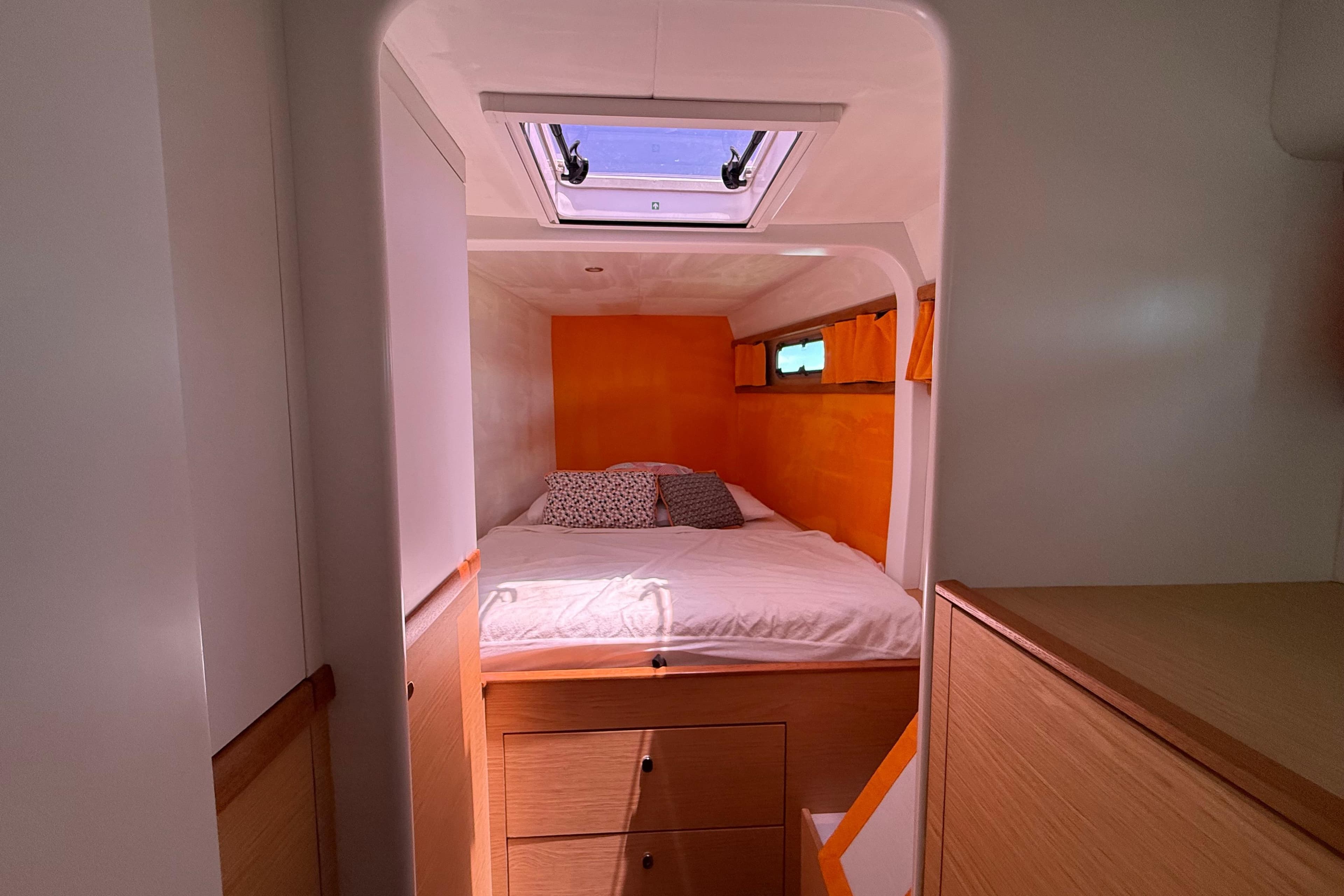 Cozy cabin interior of 2018 Swiss Cat Yachts 48 with bed and skylight.