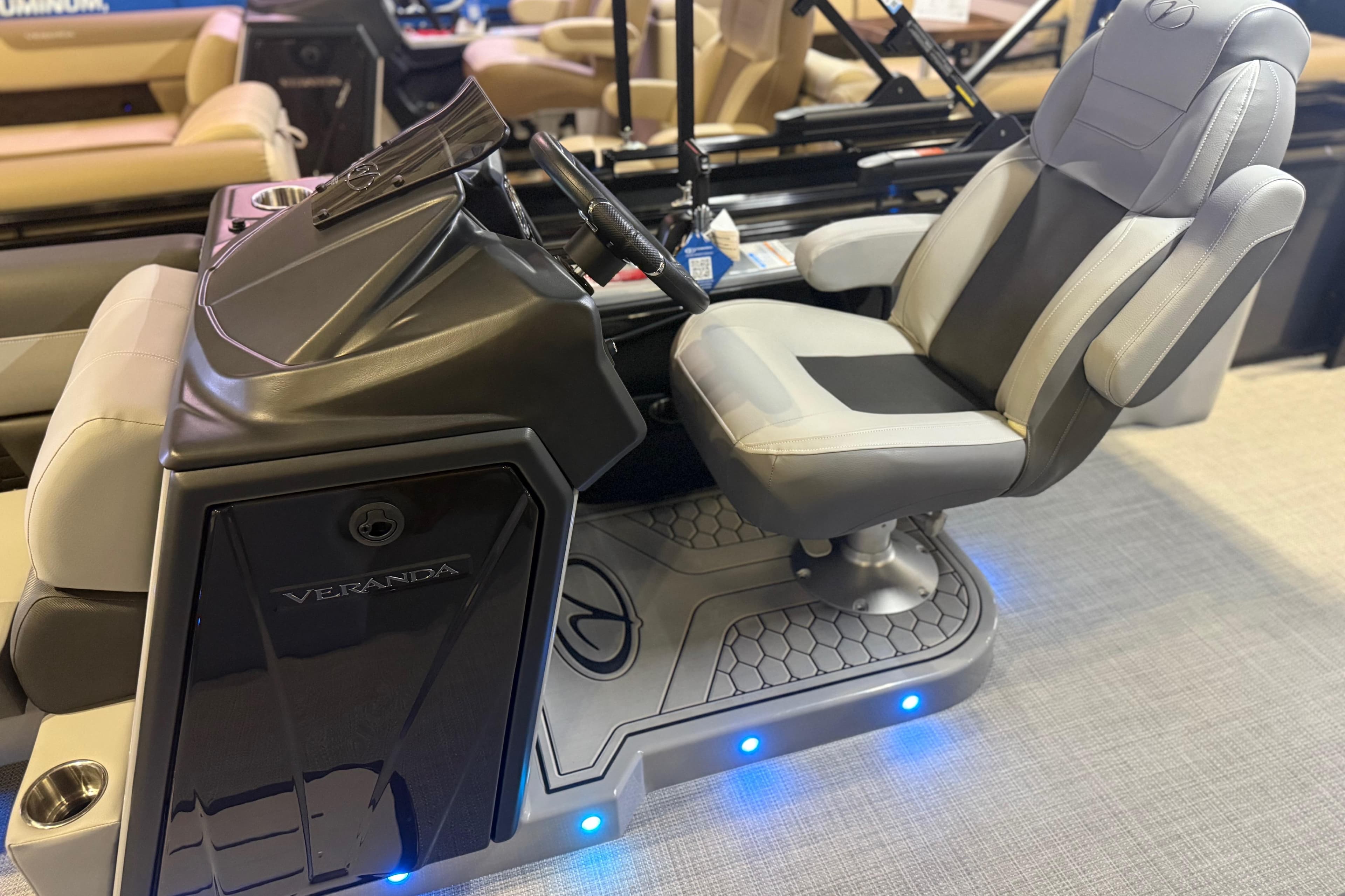 2026 Veranda VR 235 L boat helm with modern seating and illuminated controls.