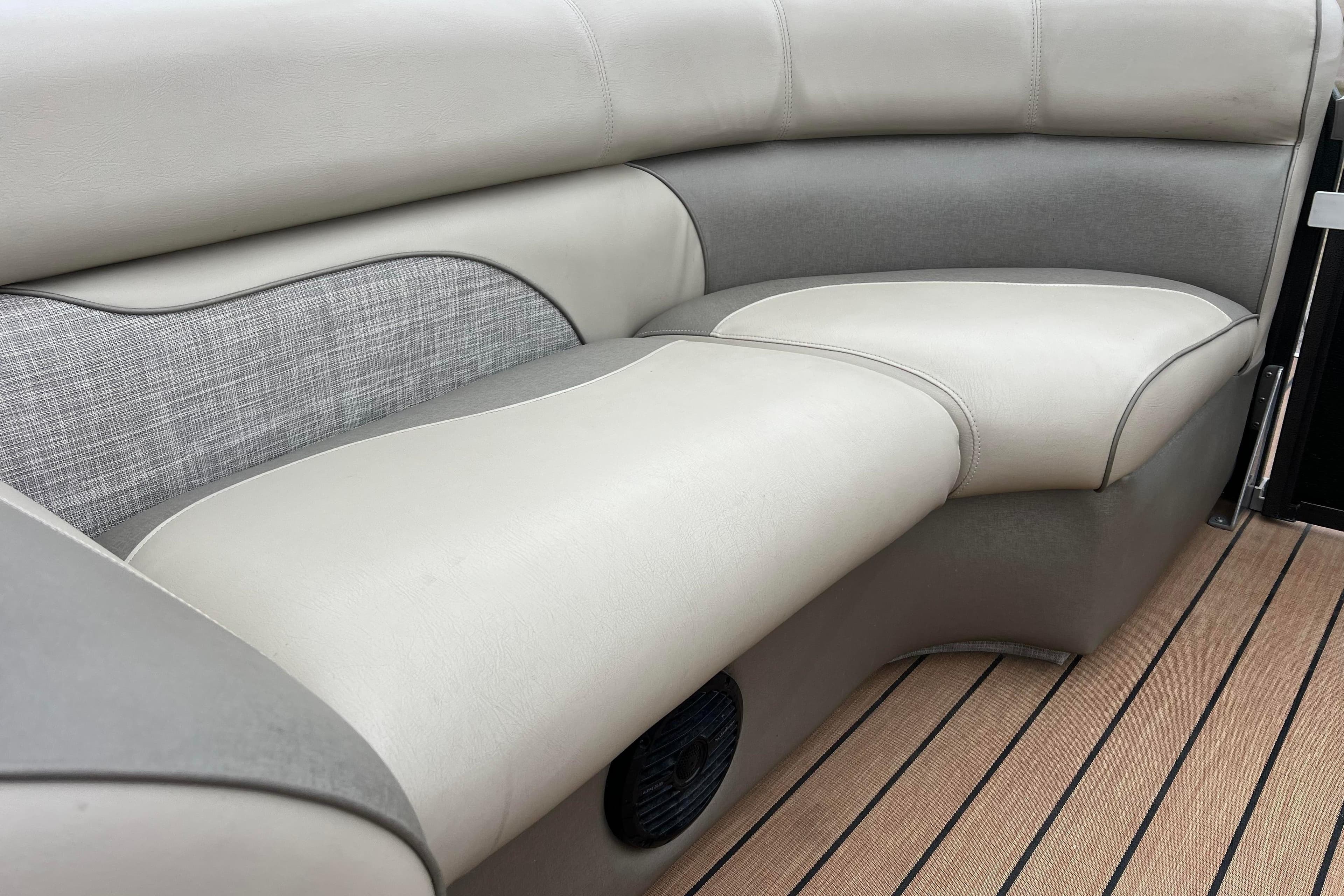 2017 Premier 230 SunSation RF boat interior seating with beige and gray upholstery.