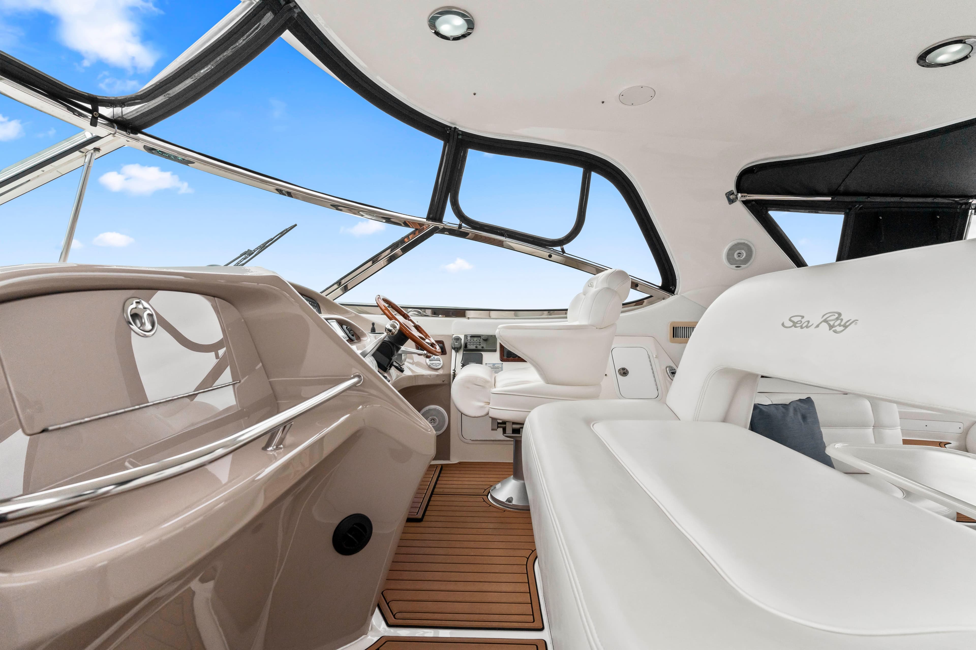 Interior of 2001 Sea Ray Sundancer 510 yacht with luxurious seating and modern helm.