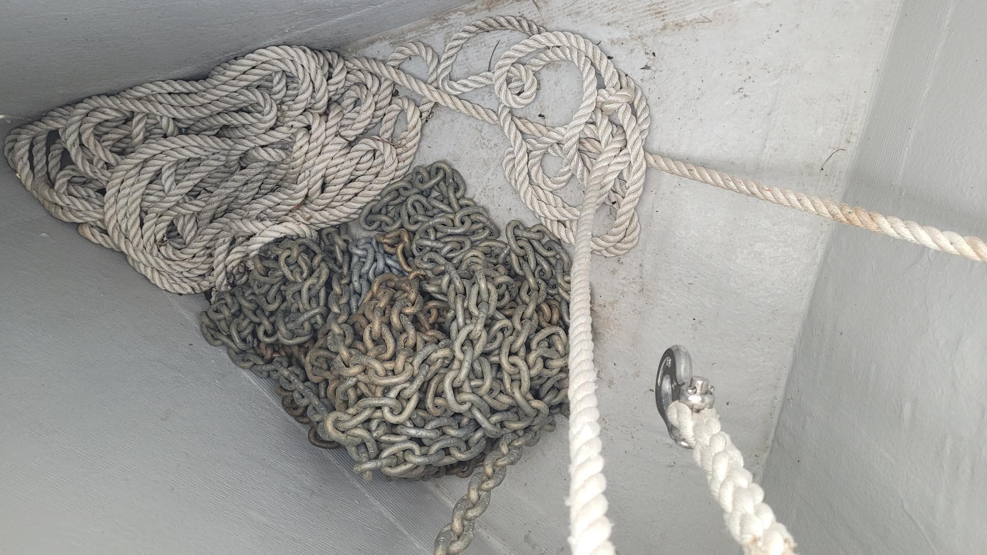 Anchor chain and rope in a Beneteau Oceanis 38.1 sailboat locker, 2020 model.