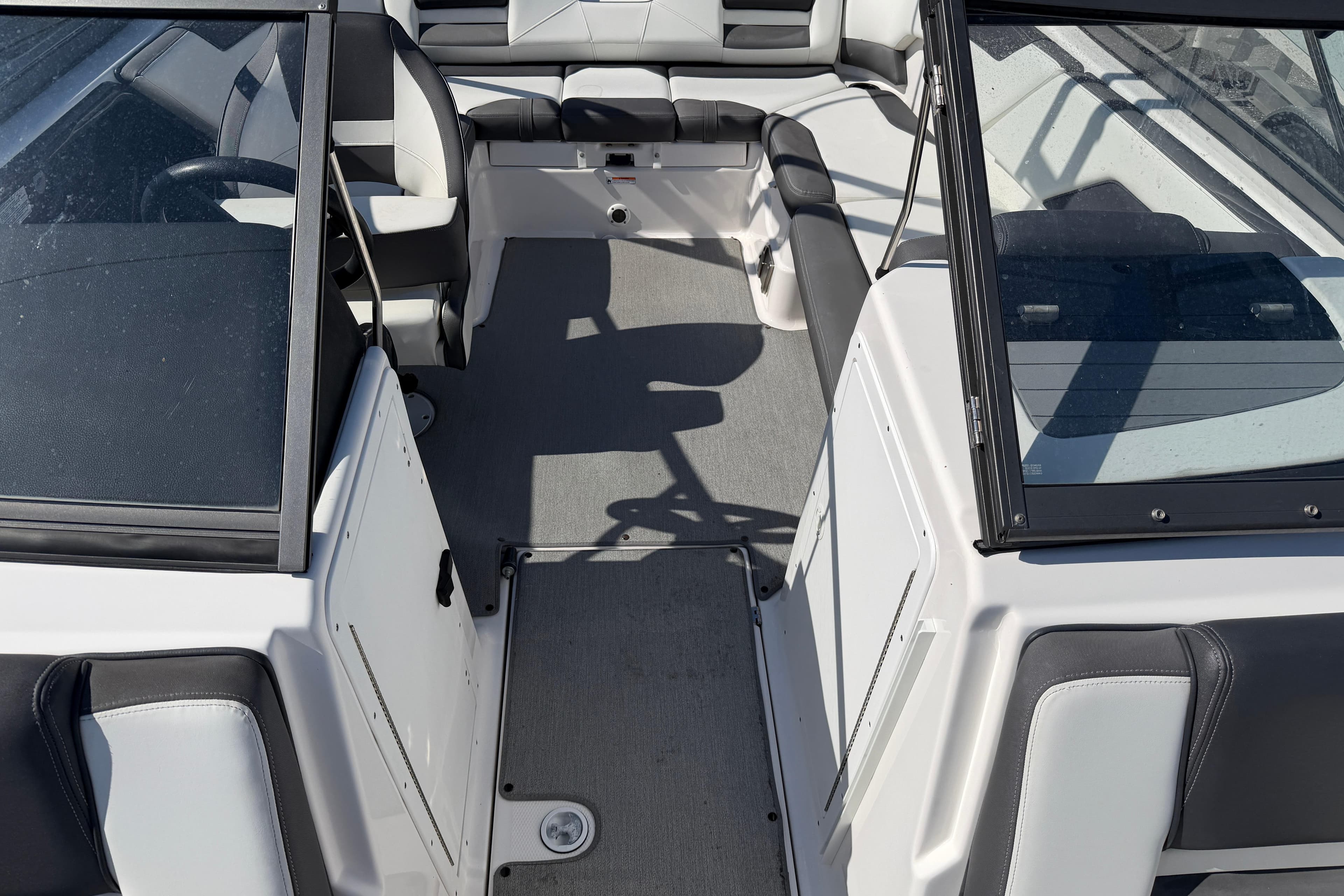 2022 Yamaha AR210 boat interior with seating and windshield view.