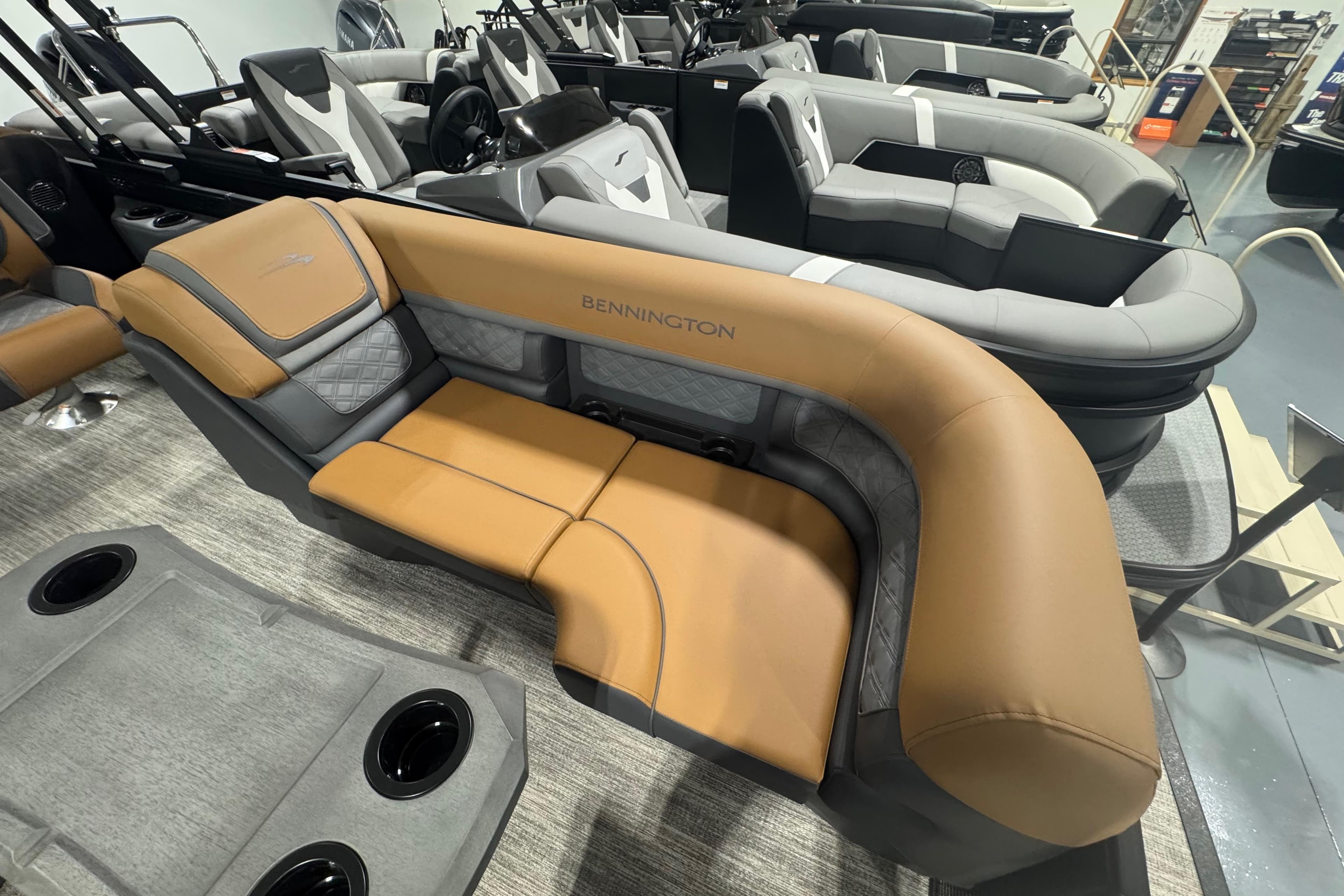 2026 Bennington 22 SSR Luxe boat interior with luxurious tan and gray seating.