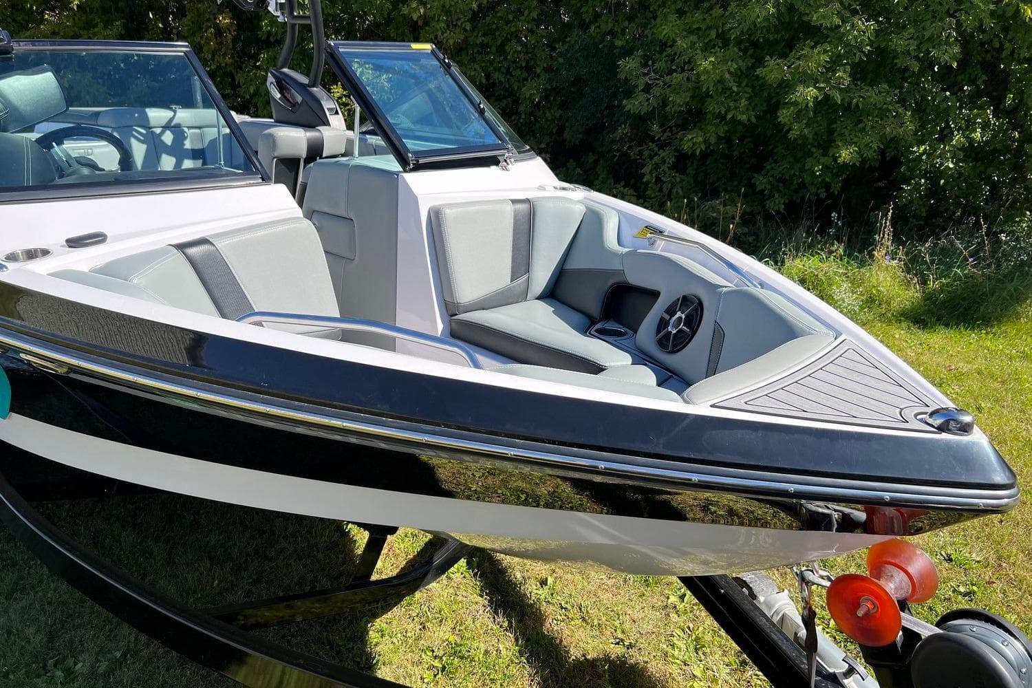 2014 Nautique Super Air Nautique 210 boat with sleek design and comfortable seating.