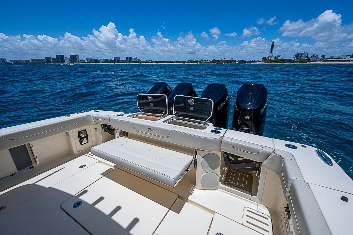 2025 Scout 425 LXF boat with powerful engines on open water.