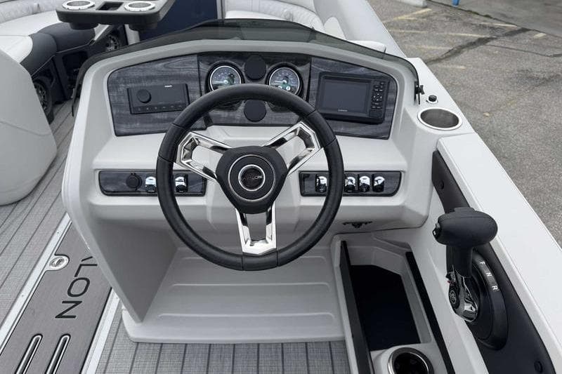 Steering console of 2026 Avalon 2385 25 LSZ VRB boat with modern controls and dashboard.
