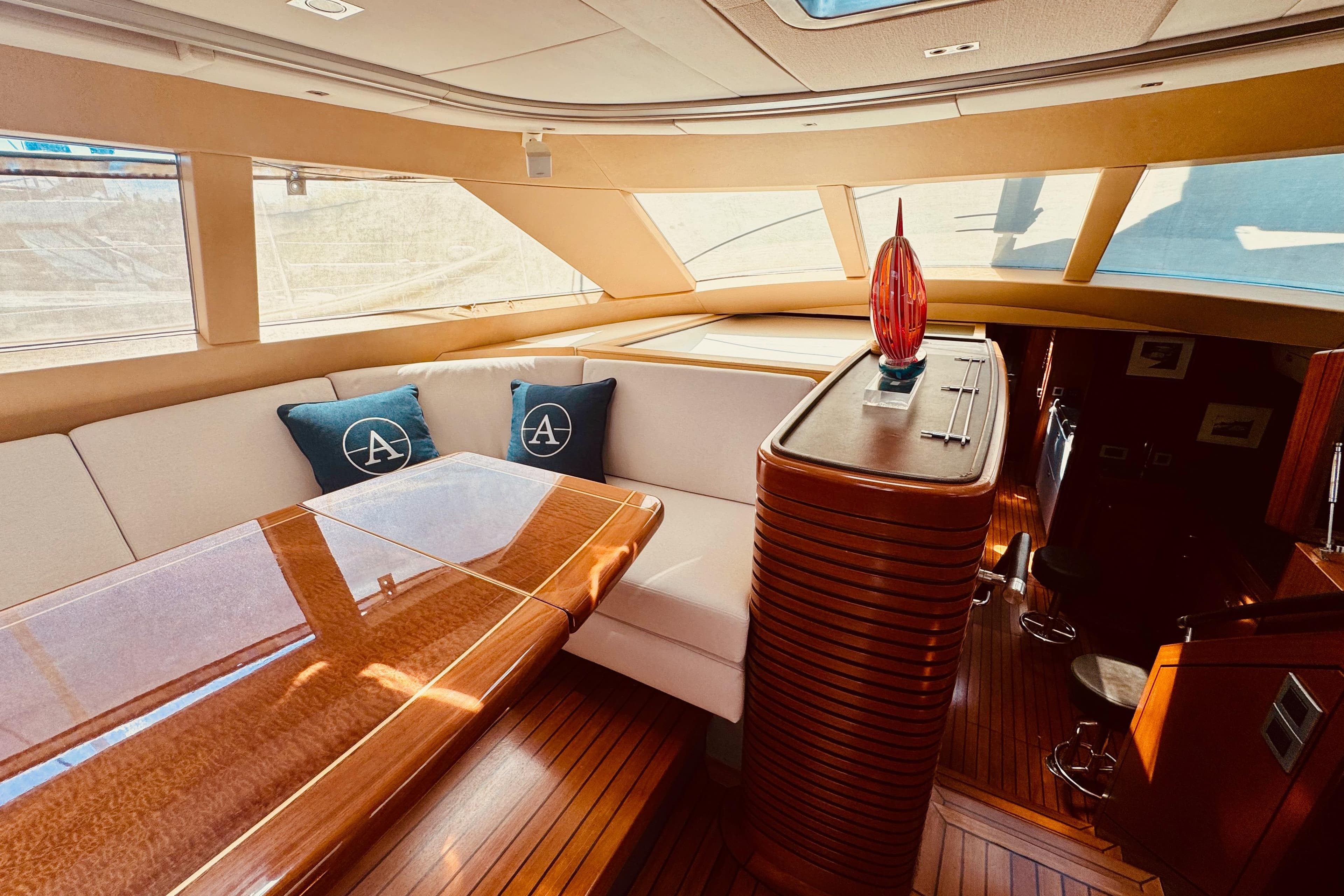 Luxurious interior of 2010 Alia Yachts Custom, featuring elegant wood finishes and plush seating.