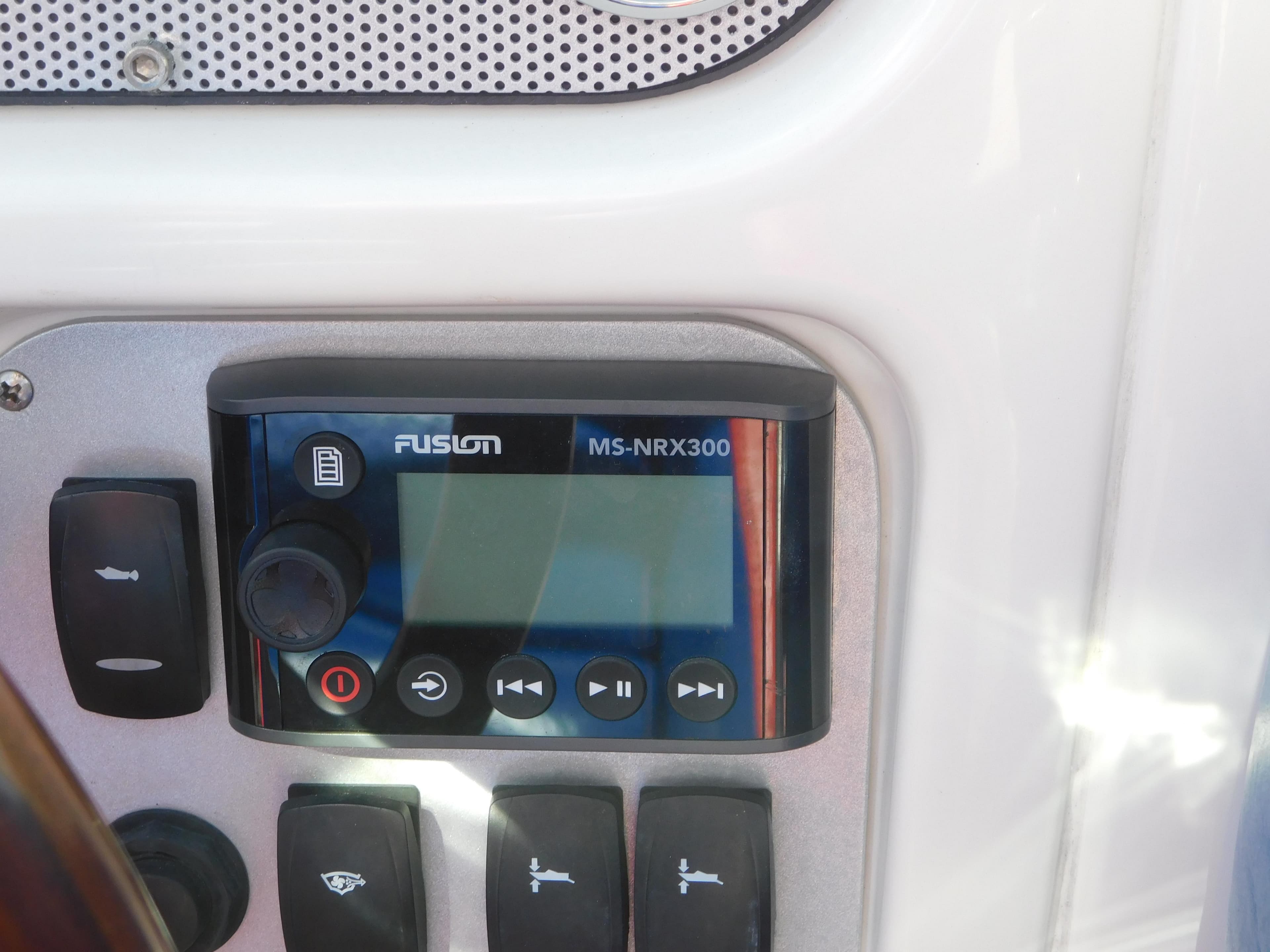 Control panel of a 2009 Chris-Craft Corsair 25 with Fusion MS-NRX300 stereo system.