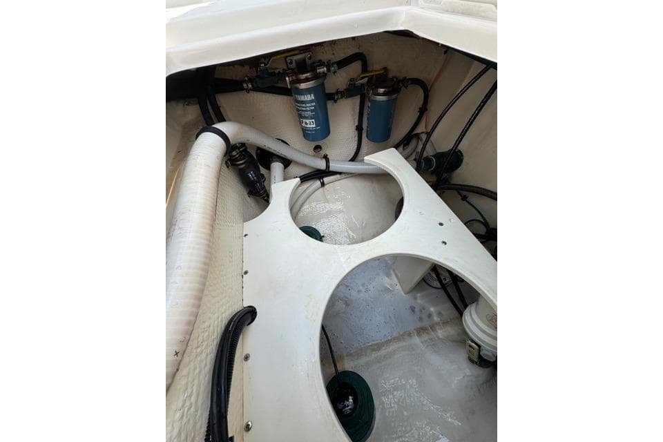 2014 Jupiter 34 boat engine compartment with Yamaha filters and hoses.