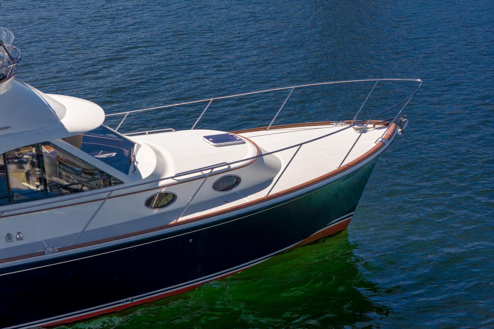 2010 San Juan SJ40FB IPS yacht on calm blue water.
