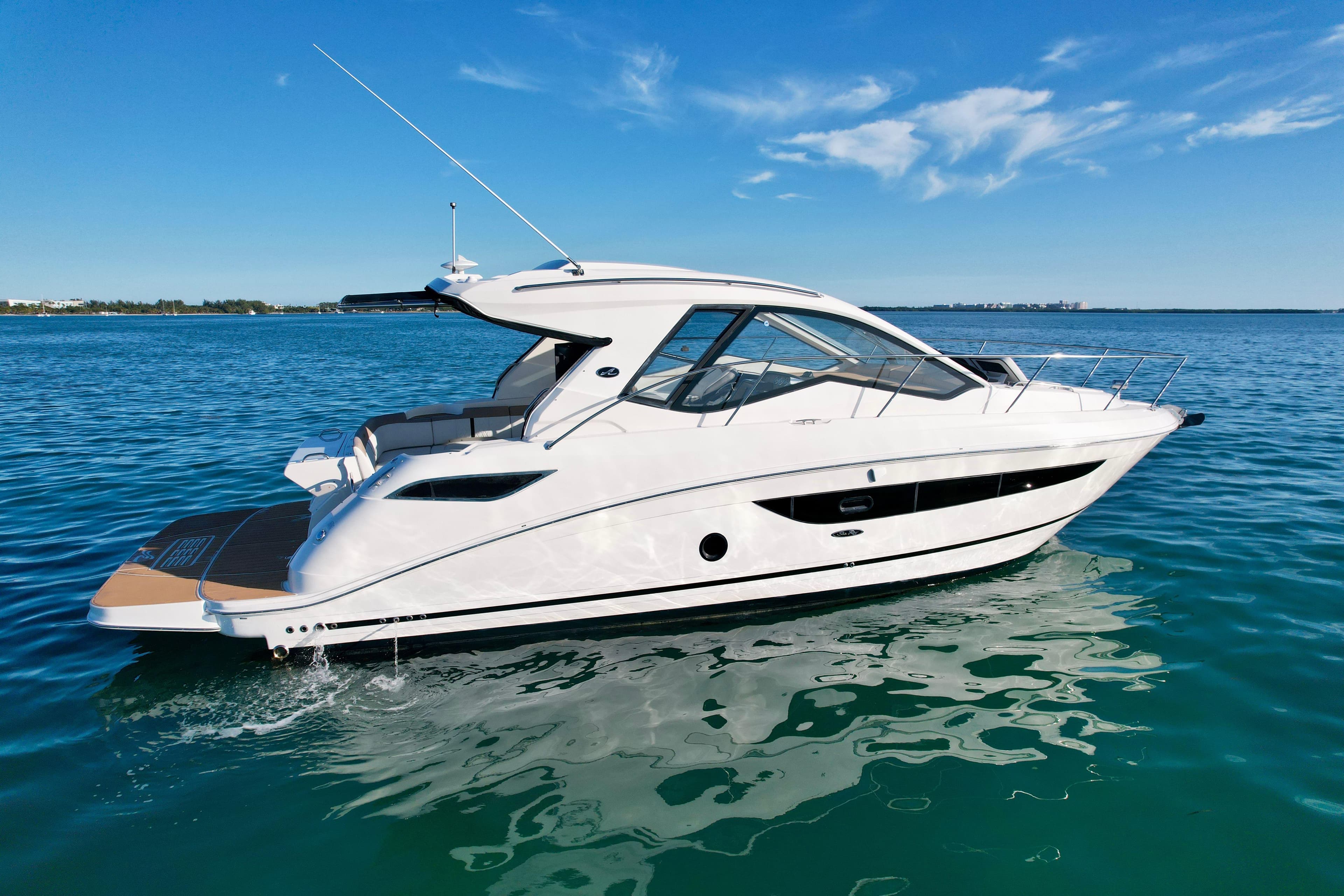 2018 Sea Ray 350 DAC yacht cruising on clear blue water.