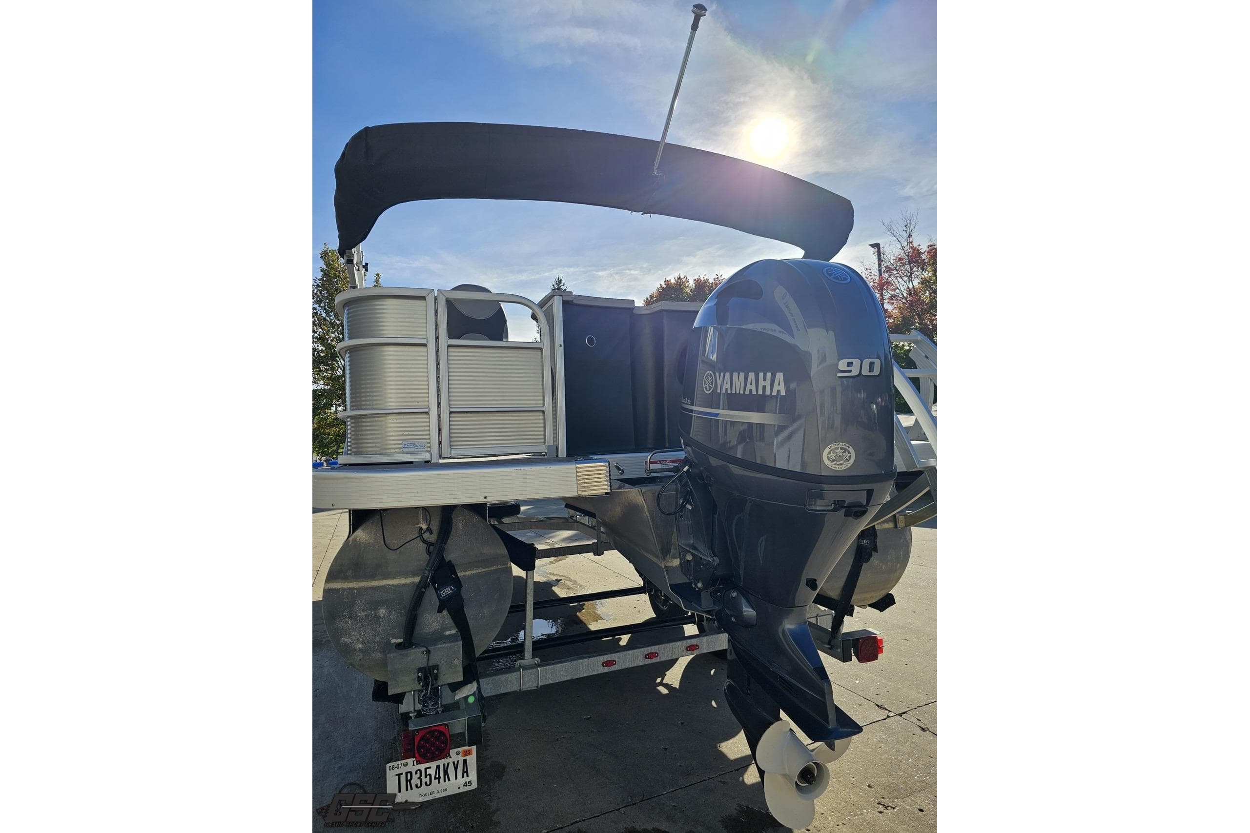 2022 Bennington SX 21 Fishing boat with Yamaha 90 outboard motor in sunlight.