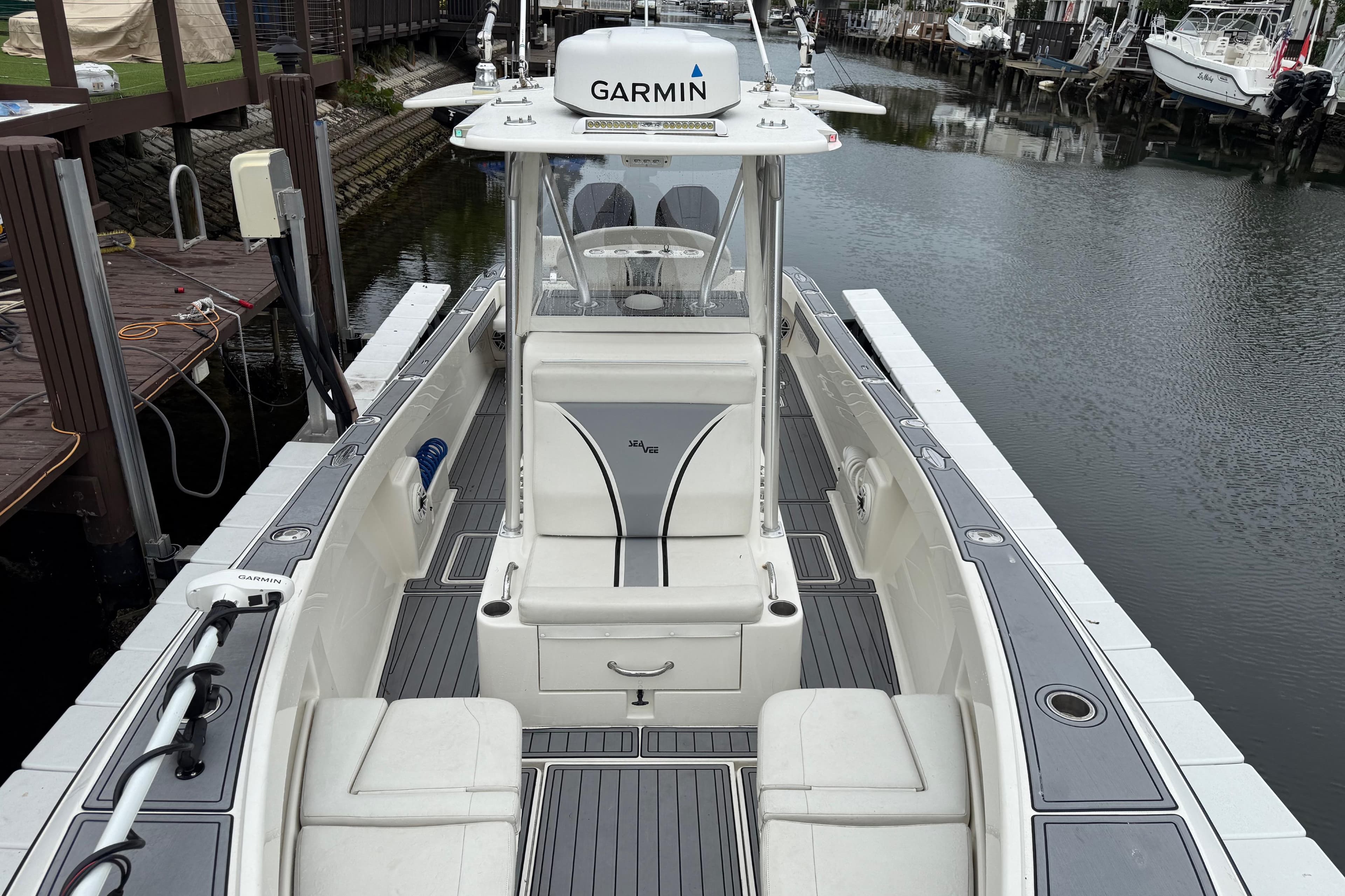 2020 SeaVee 290B boat with Garmin equipment docked in a marina.