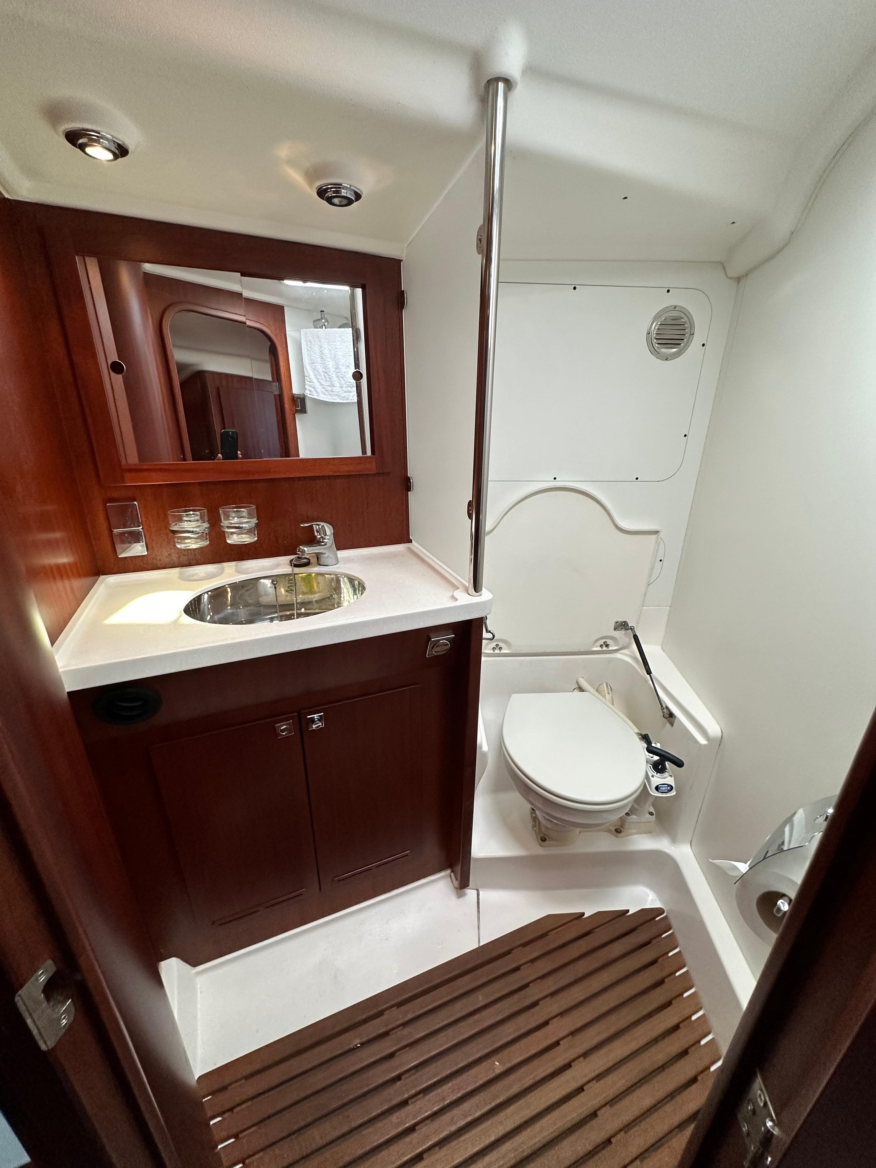 Luxurious 2007 Maxi 1300 yacht bathroom with wooden accents and modern fixtures.