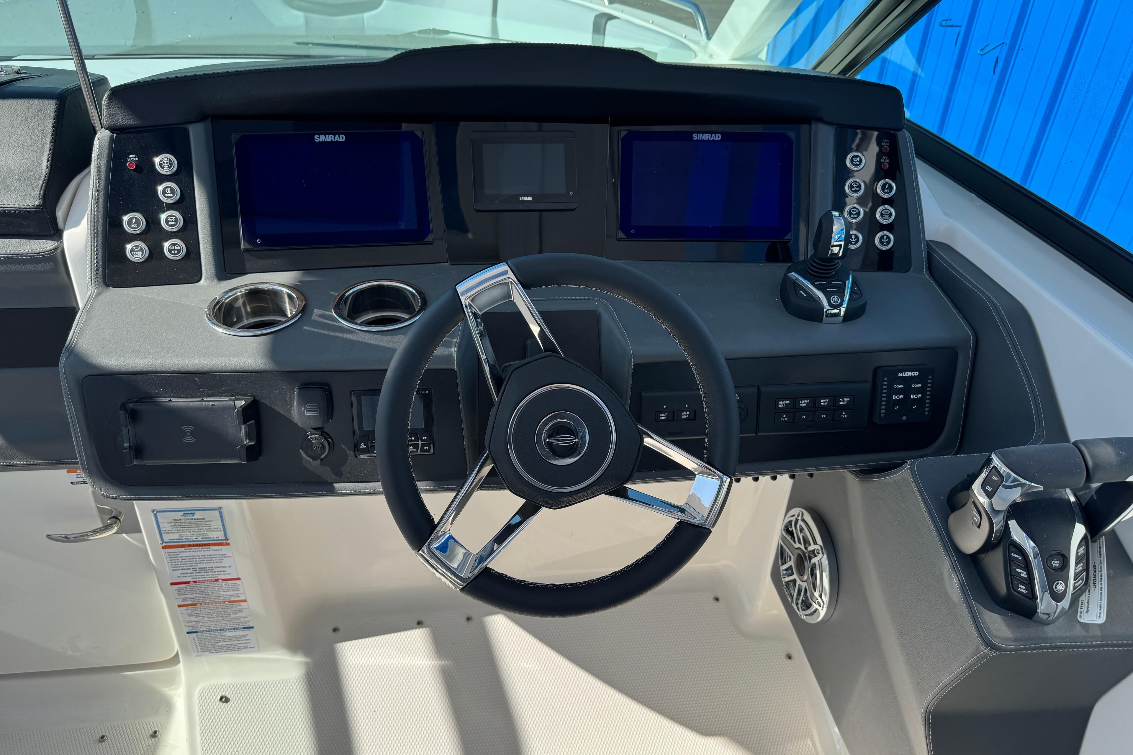 Helm of 2026 Chaparral 280 OSX boat with modern controls and dual displays.