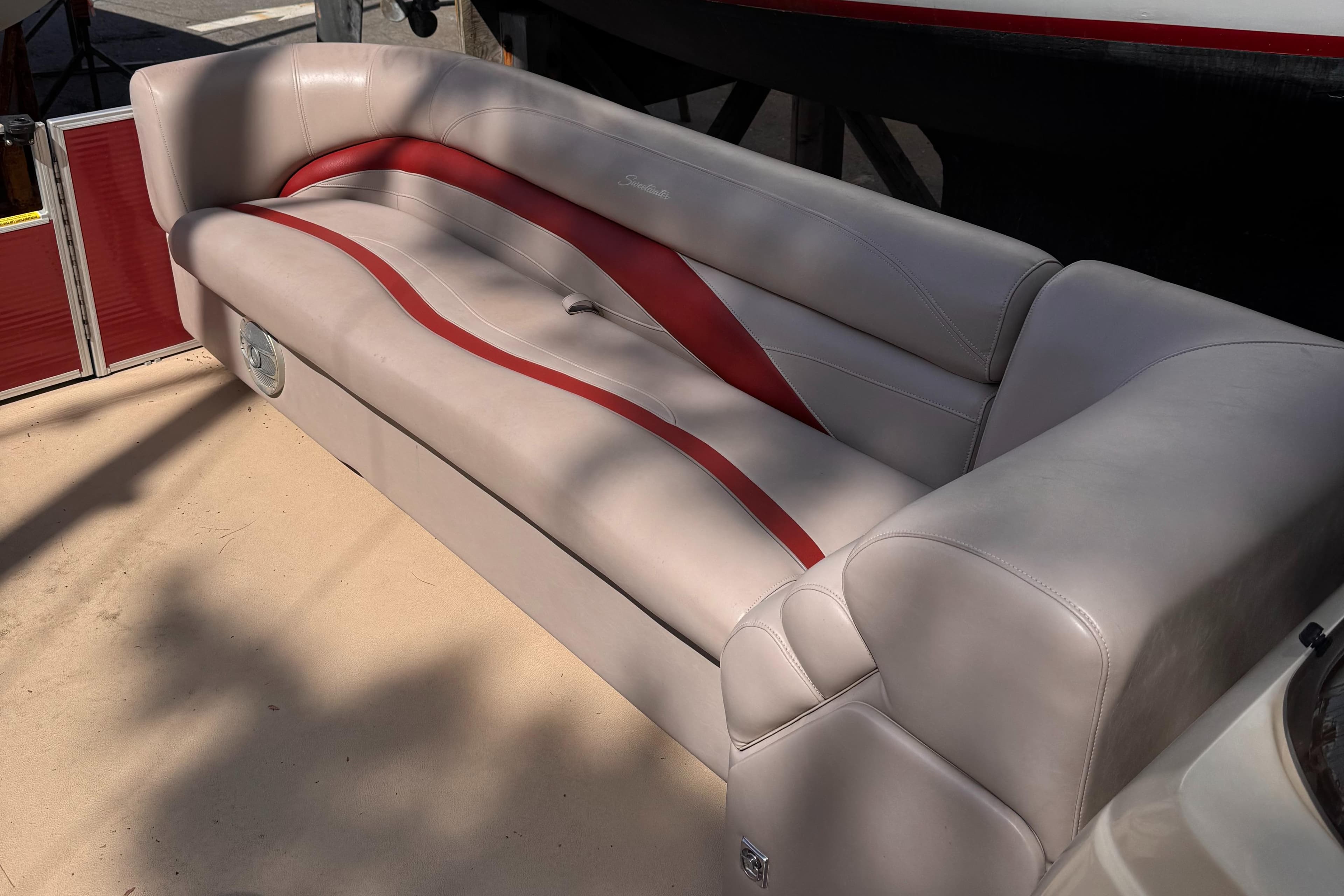 Luxurious Sweetwater Premium Edition 200 boat seating, 2015 model, with beige and red accents.