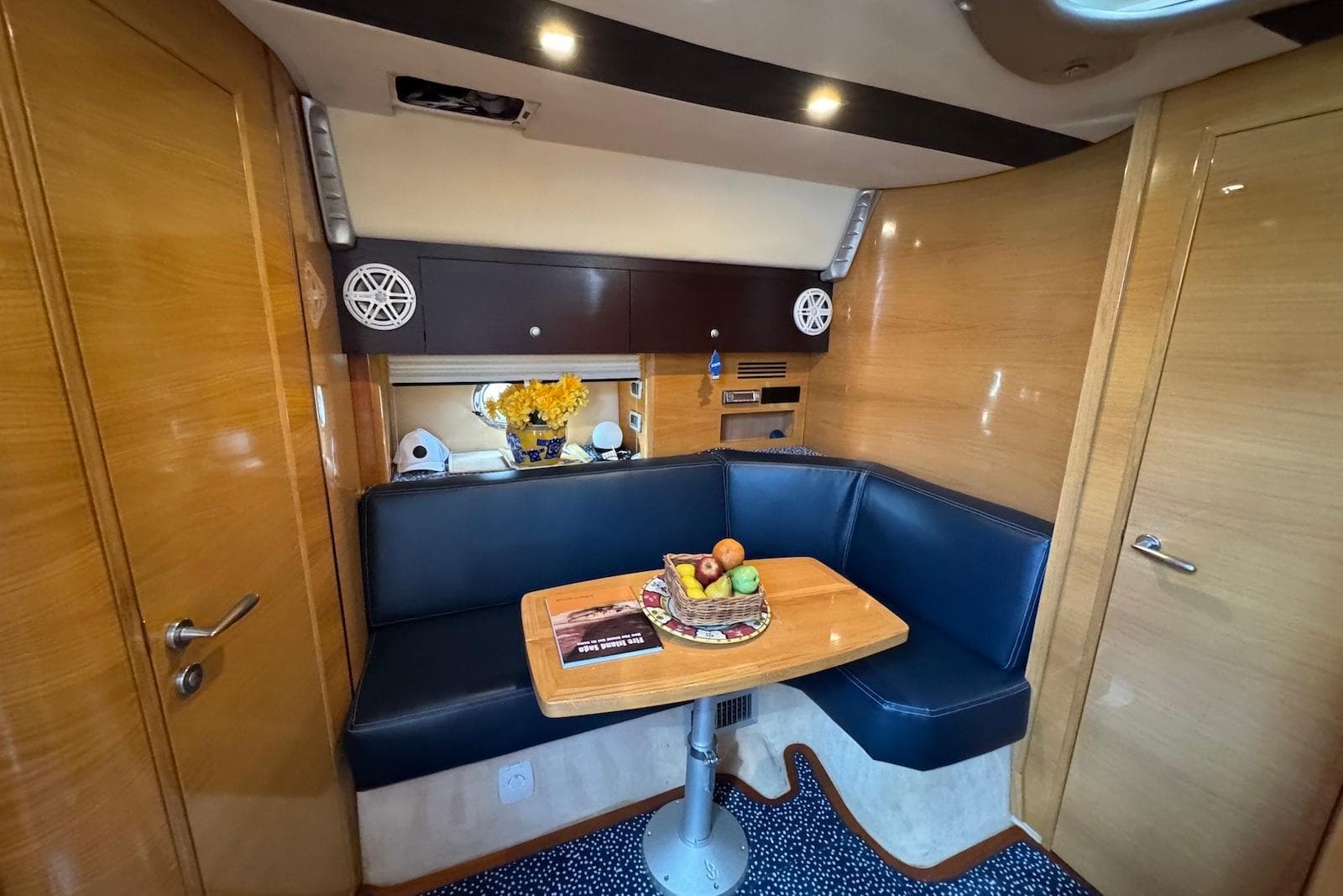 Luxurious 2009 Cranchi Mediterranee 43 yacht interior with cozy seating and elegant decor.